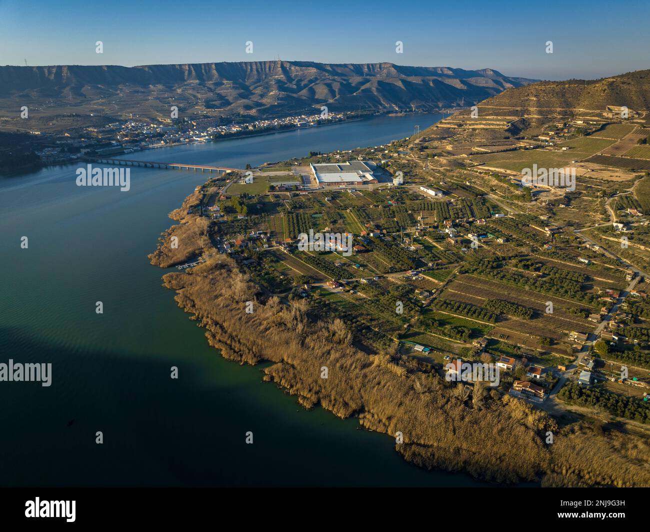 Aerial view of the fields and orchards next to the river, at the