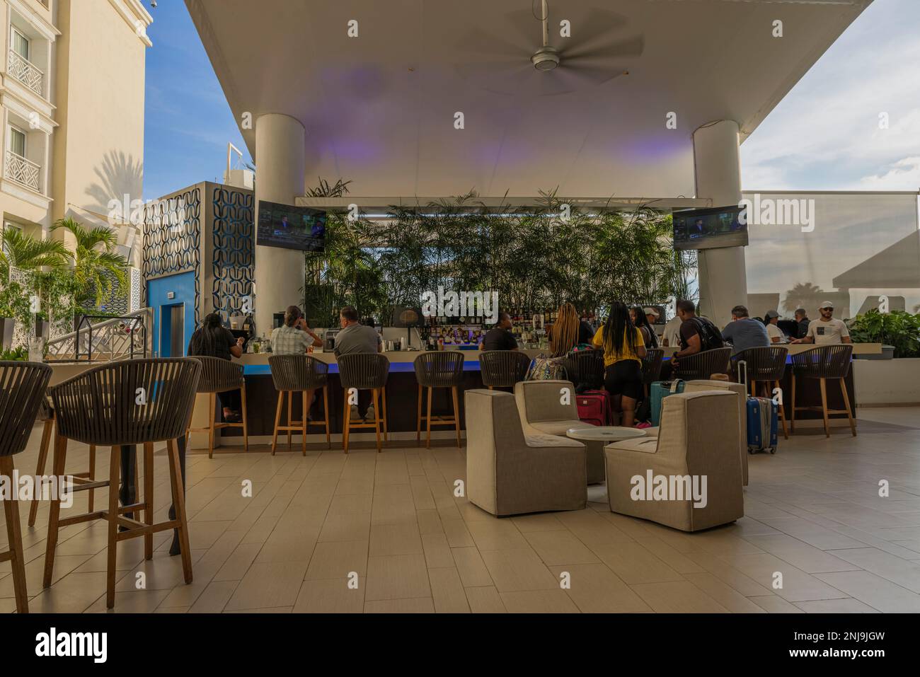 Beautiful view of people at outdoor hotel bar. Aruba. Renaissance Aruba Resort. Aruba Stock