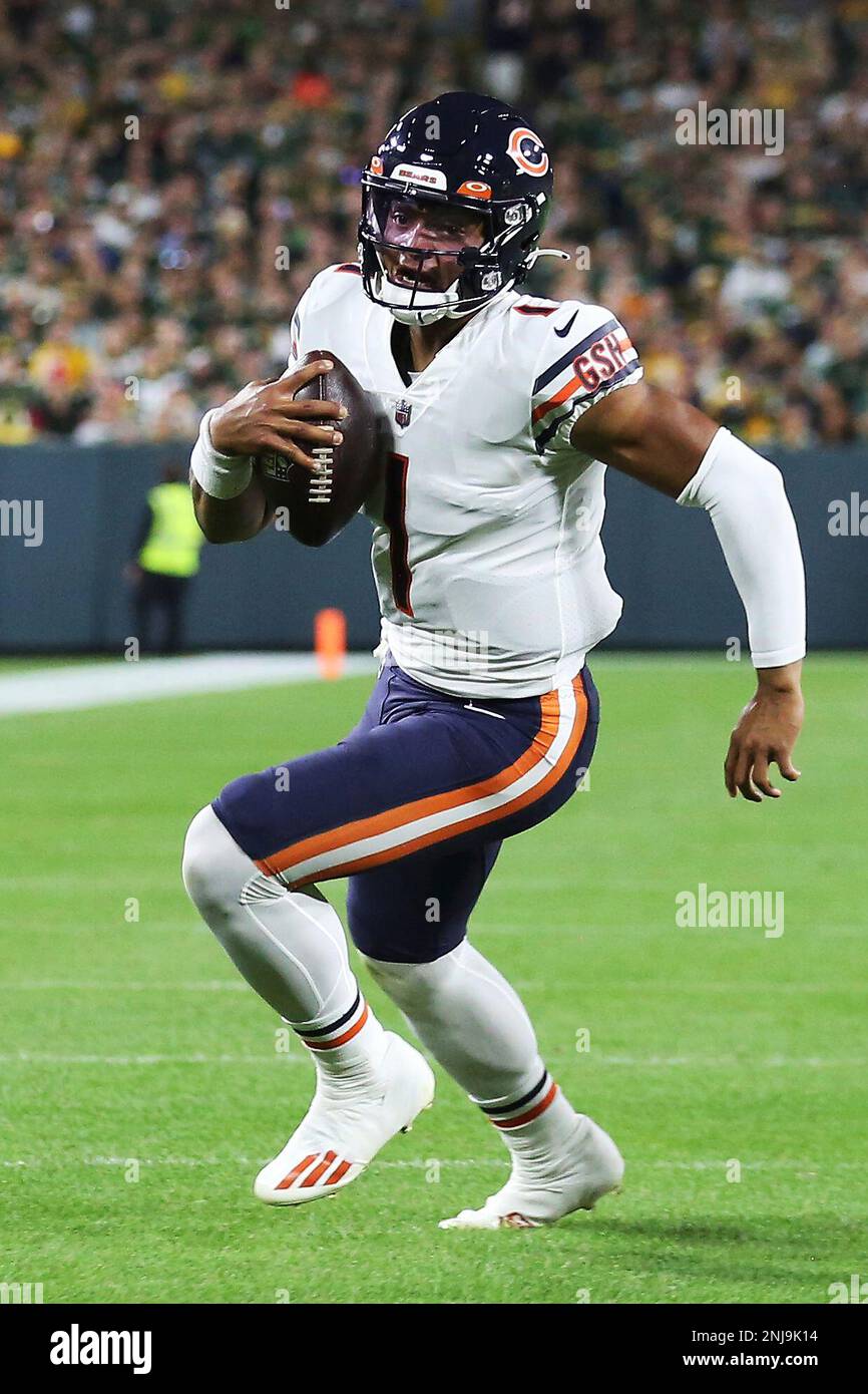 GREEN BAY, WI - SEPTEMBER 18: Chicago Bears quarterback Justin Fields (1)  runs during a game between the Green Bay Packers and the Chicago Bears on September  18, 2022 at Lambeau Field