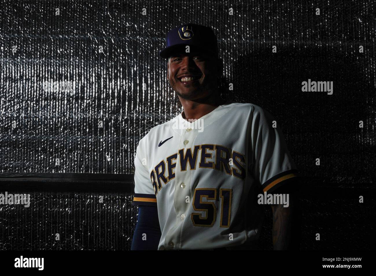 Milwaukee Brewers' Freddy Peralta poses for a picture with a