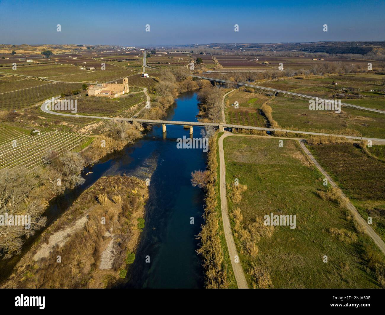 Confluence of the Segre and Cinca rivers, where you can see the different contribution of sediments from each river (Segrià, Lleida, Catalonia, Spain) Stock Photo