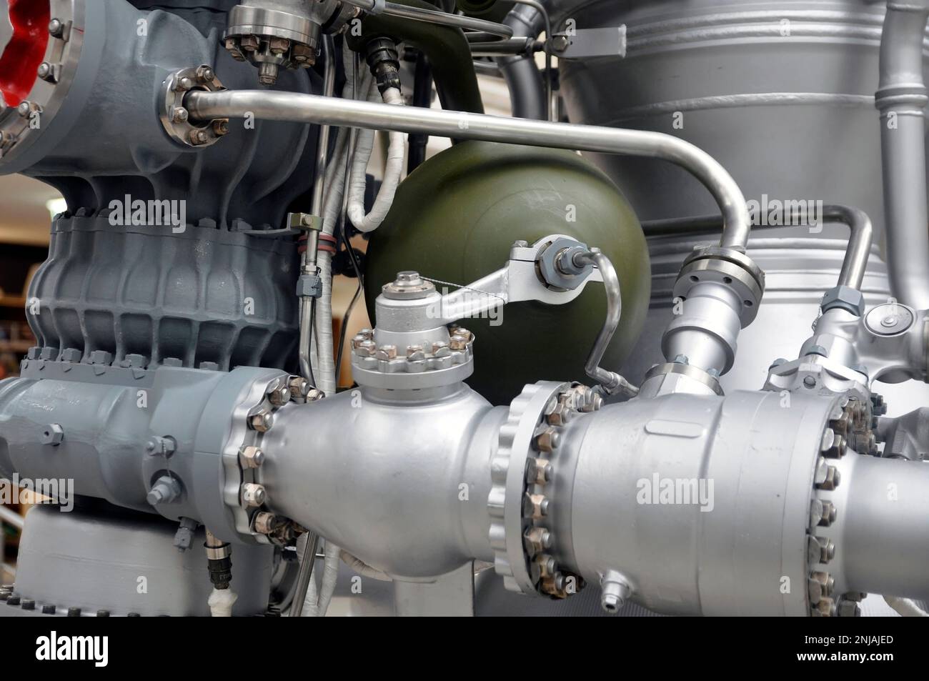 Elements of a rocket engine with several pipelines supplying fuel and coolant to the combustion