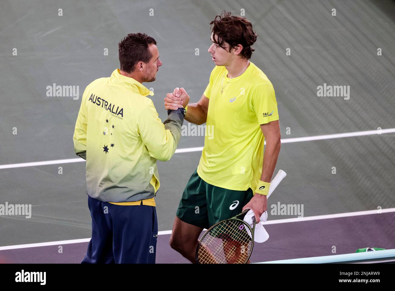 Australian team captain Lleyton Hewitt, left, congratulates Alex de Minaur after a Davis Cup Australian team captain Lleyton Hewitt, left, congratulates Alex de Minaur after a Davis Cup