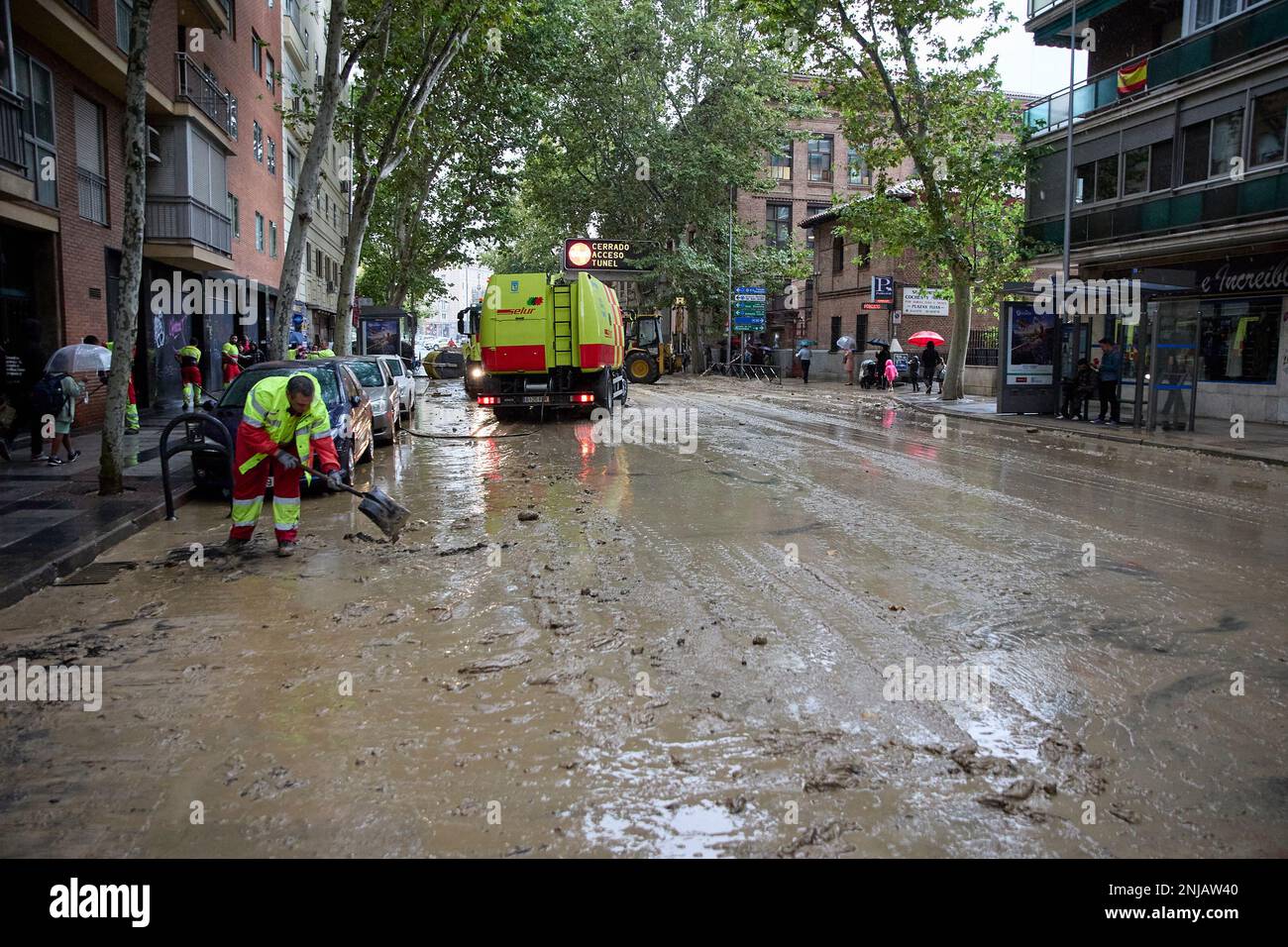 An operator works on the flooding of Marqués de Vadillo street after a