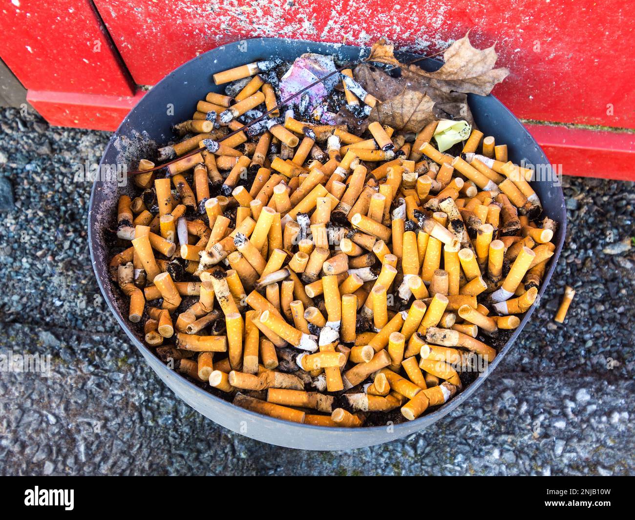 Used cigarettes in ashtray hi-res stock photography and images
