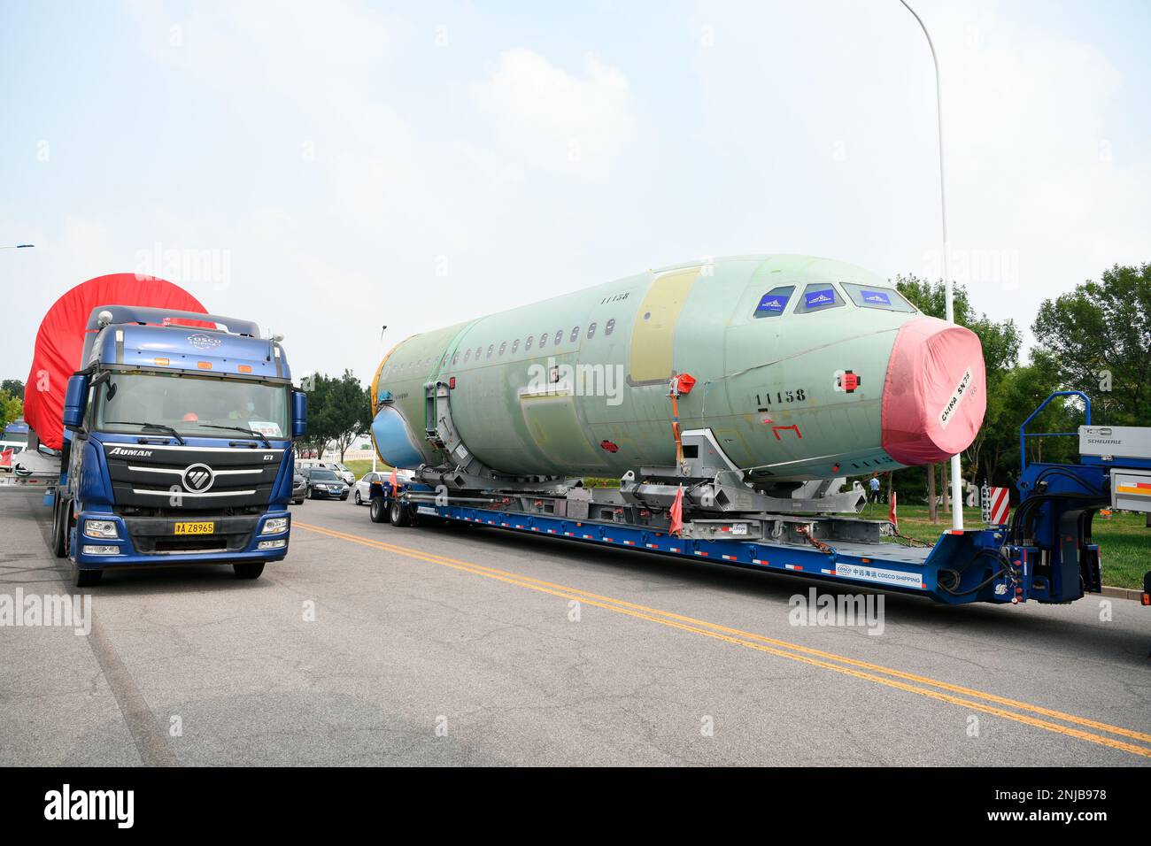 Trucks carry the first batch of two large parts of A321, from Hamburg ...