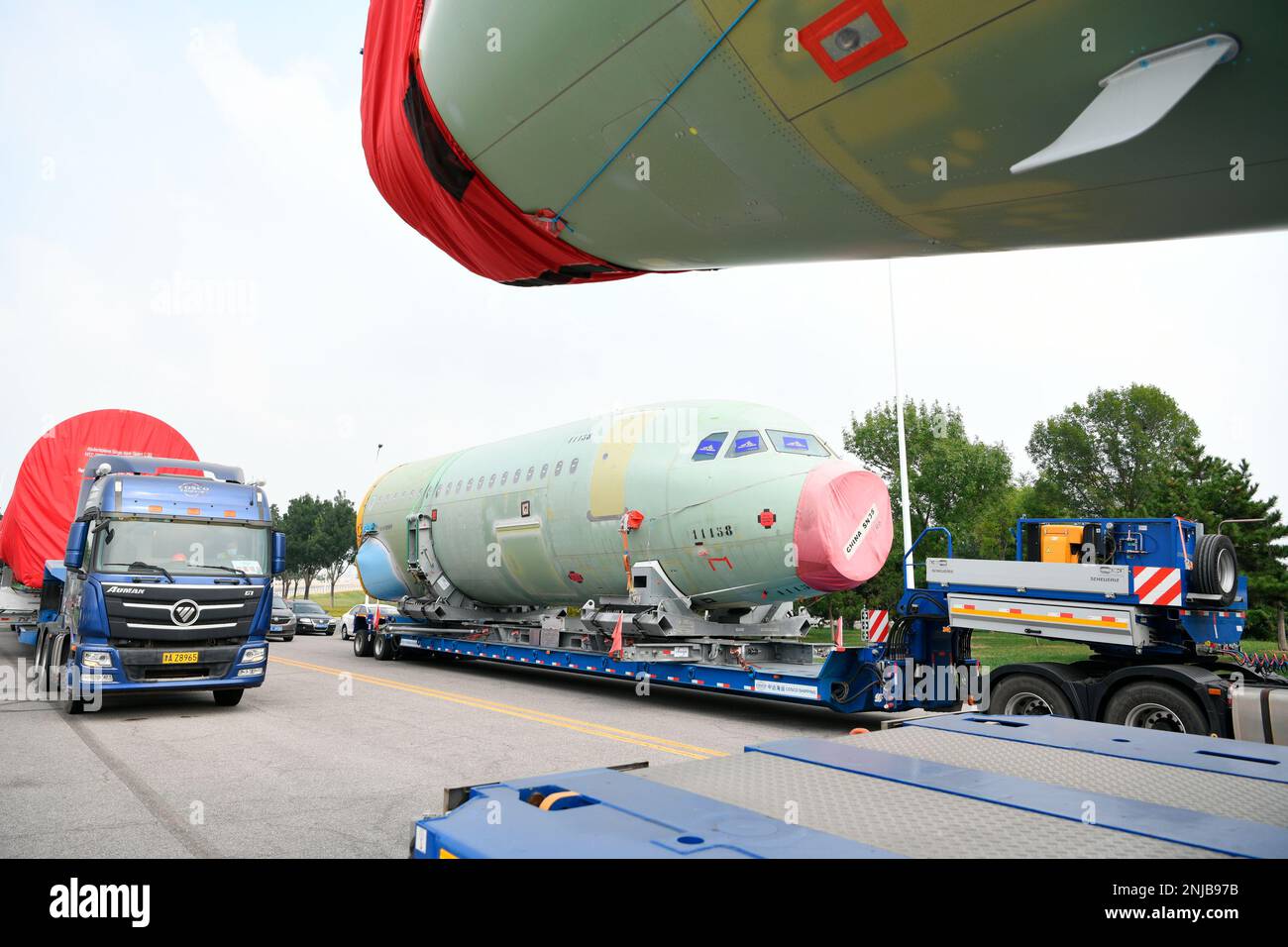 Trucks carry the first batch of two large parts of A321, from Hamburg ...