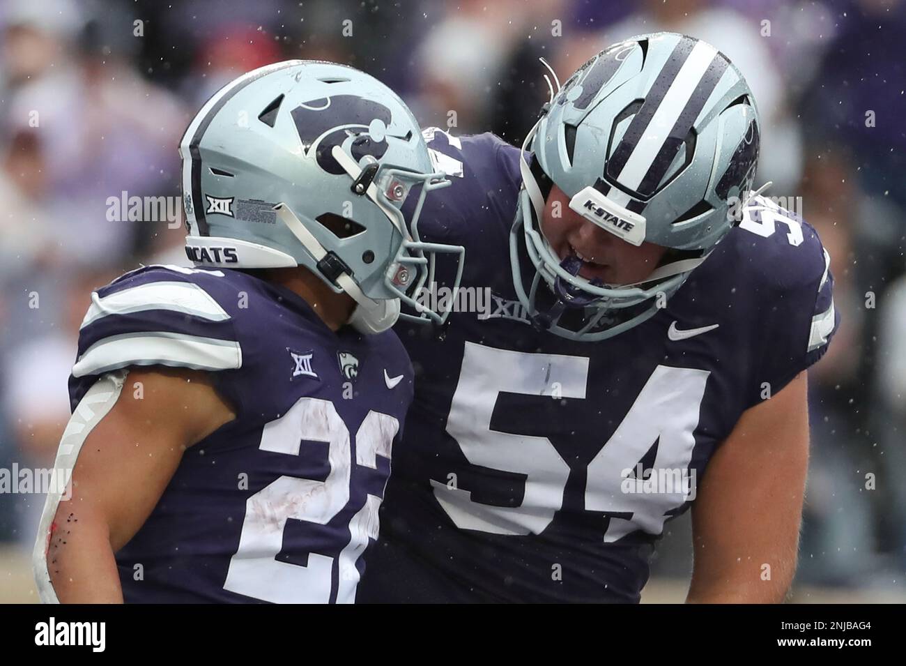 MANHATTAN, KS - SEPTEMBER 10: Kansas State Wildcats offensive lineman  Hadley Panzer (54) congratulates running back Deuce Vaughn (22) after his  24-yard touchdown run in the fourth quarter of a college football