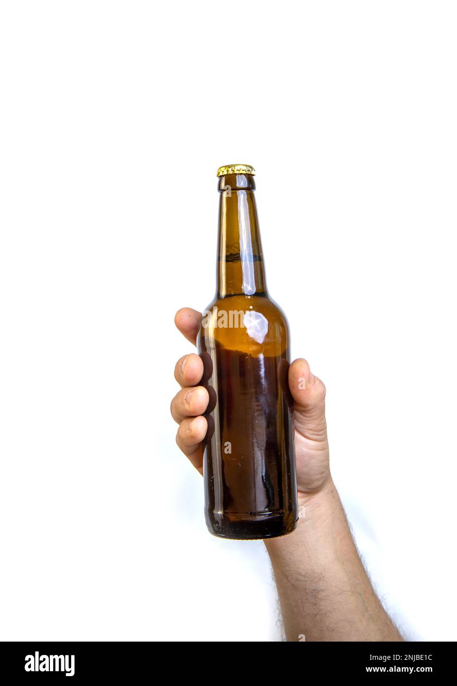 Beer bottle in hand isolated on white Stock Photo