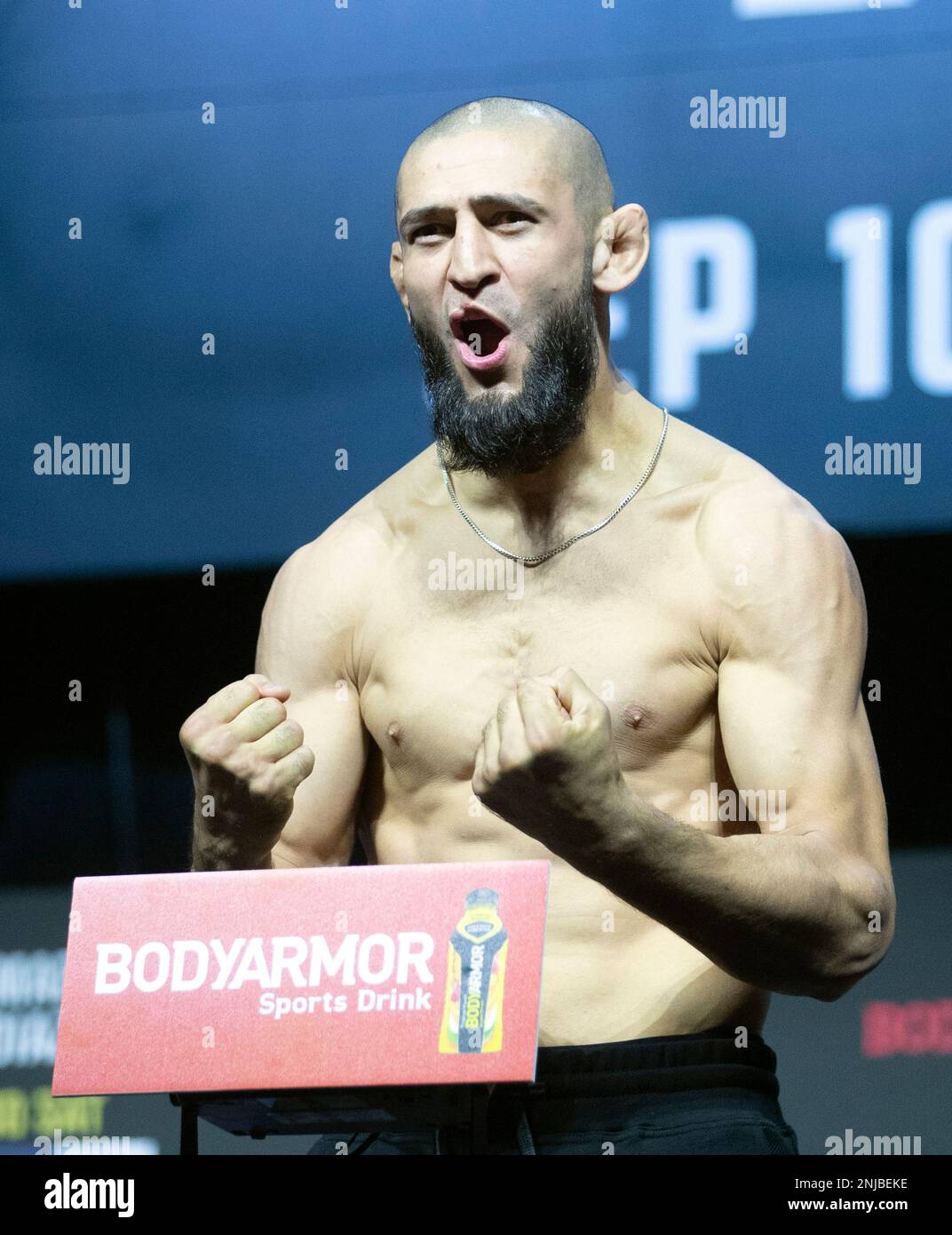 UFC fighter Khamzat Chimaev poses on the scale during a ceremonial weigh-in for the UFC 279 mixed martial arts event Friday, Sept