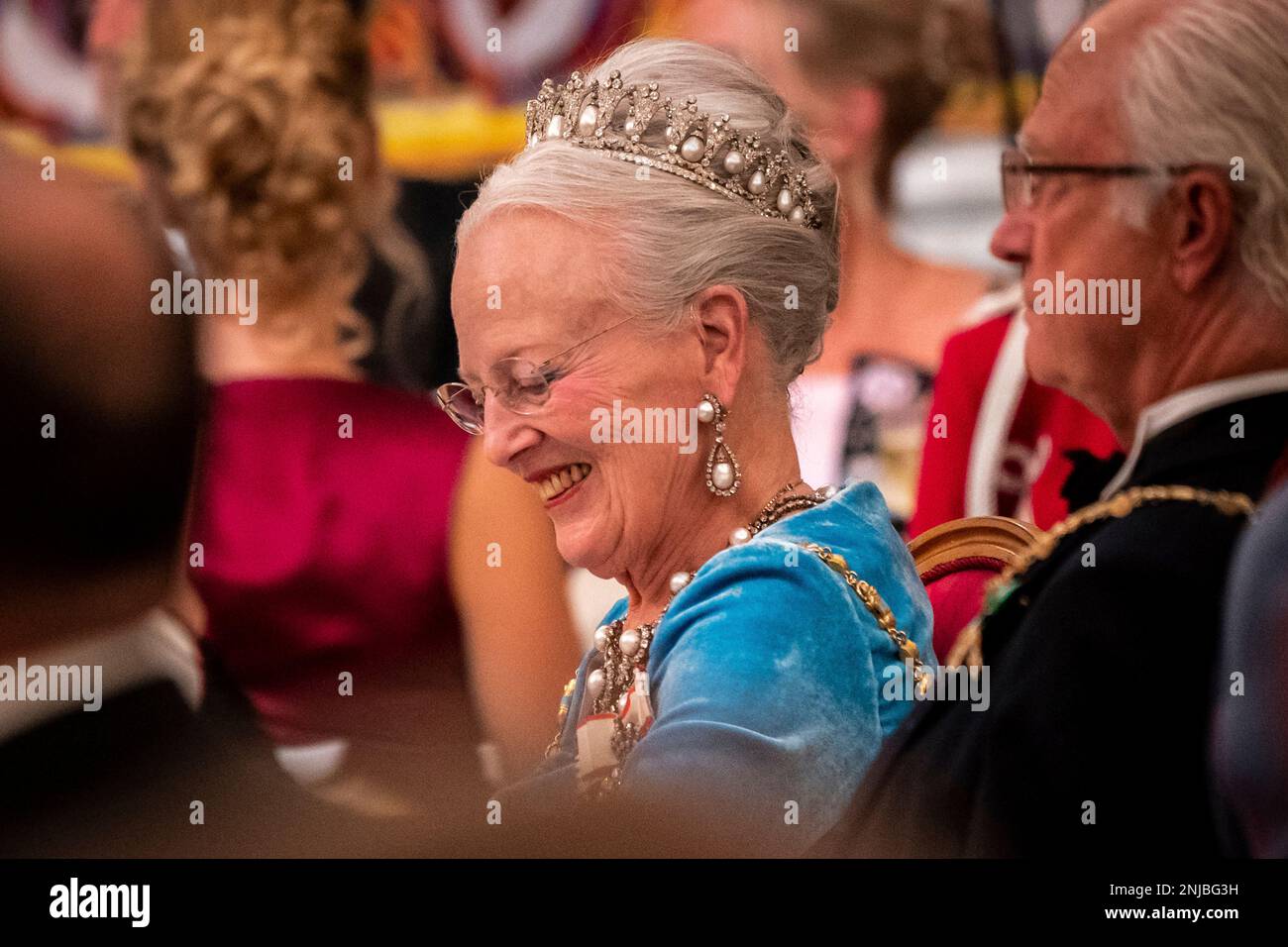 Danish Queen Margrethe listens while Danish Prime Minister Mette