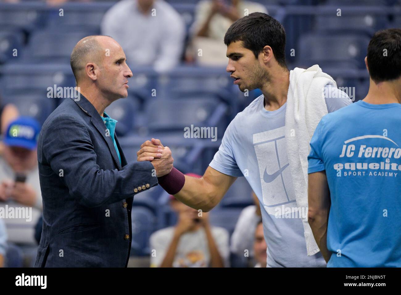 Carlos Alcaraz with agent Alberto Molina Lopez around the grounds at