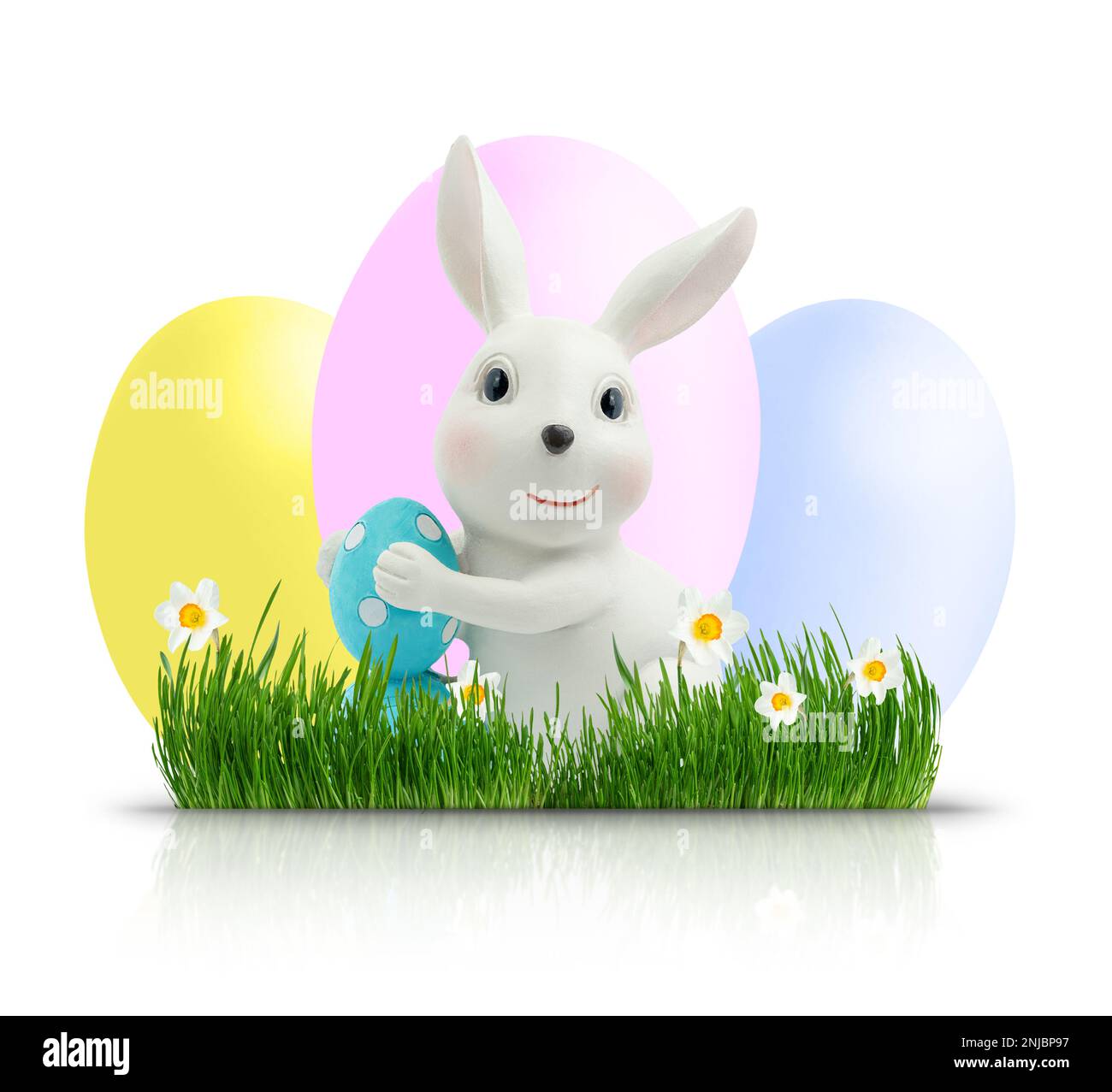 Easter bunny with coloured eggs on green grass isolated with clipping ...