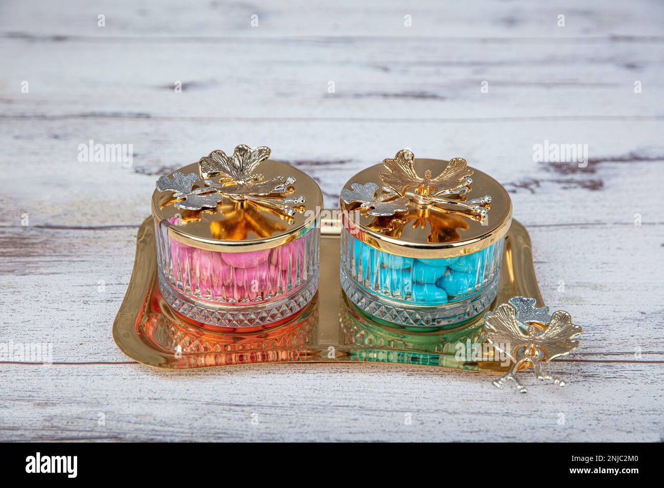 Colorful and chocolate covered almond candies in pastel tones in