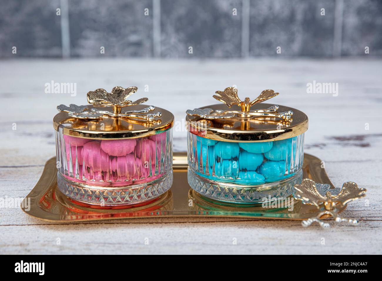 Colorful and chocolate covered almond candies in pastel tones in