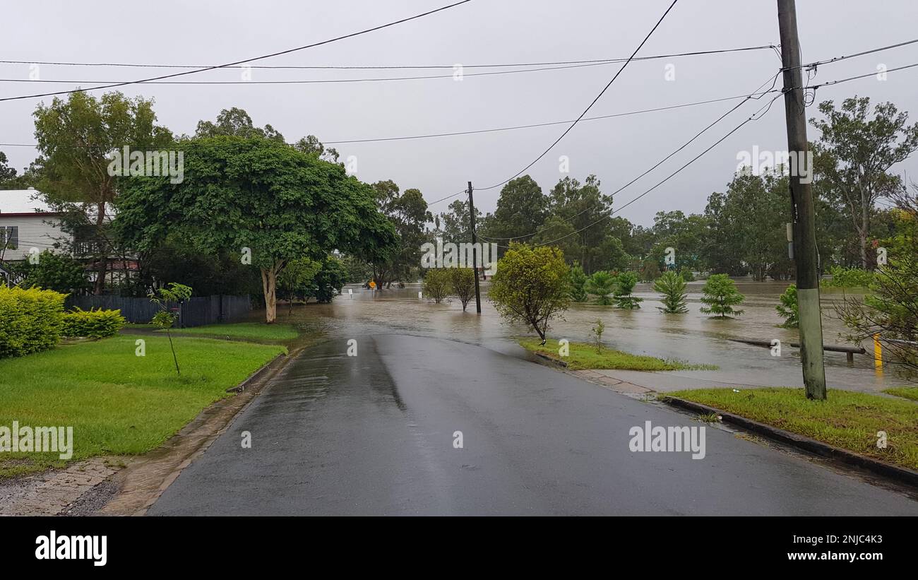 Brisbane, Australia - Feb 27, 2022: Road and park flooded after the heavy rain in Rocklea suburb Stock Photo