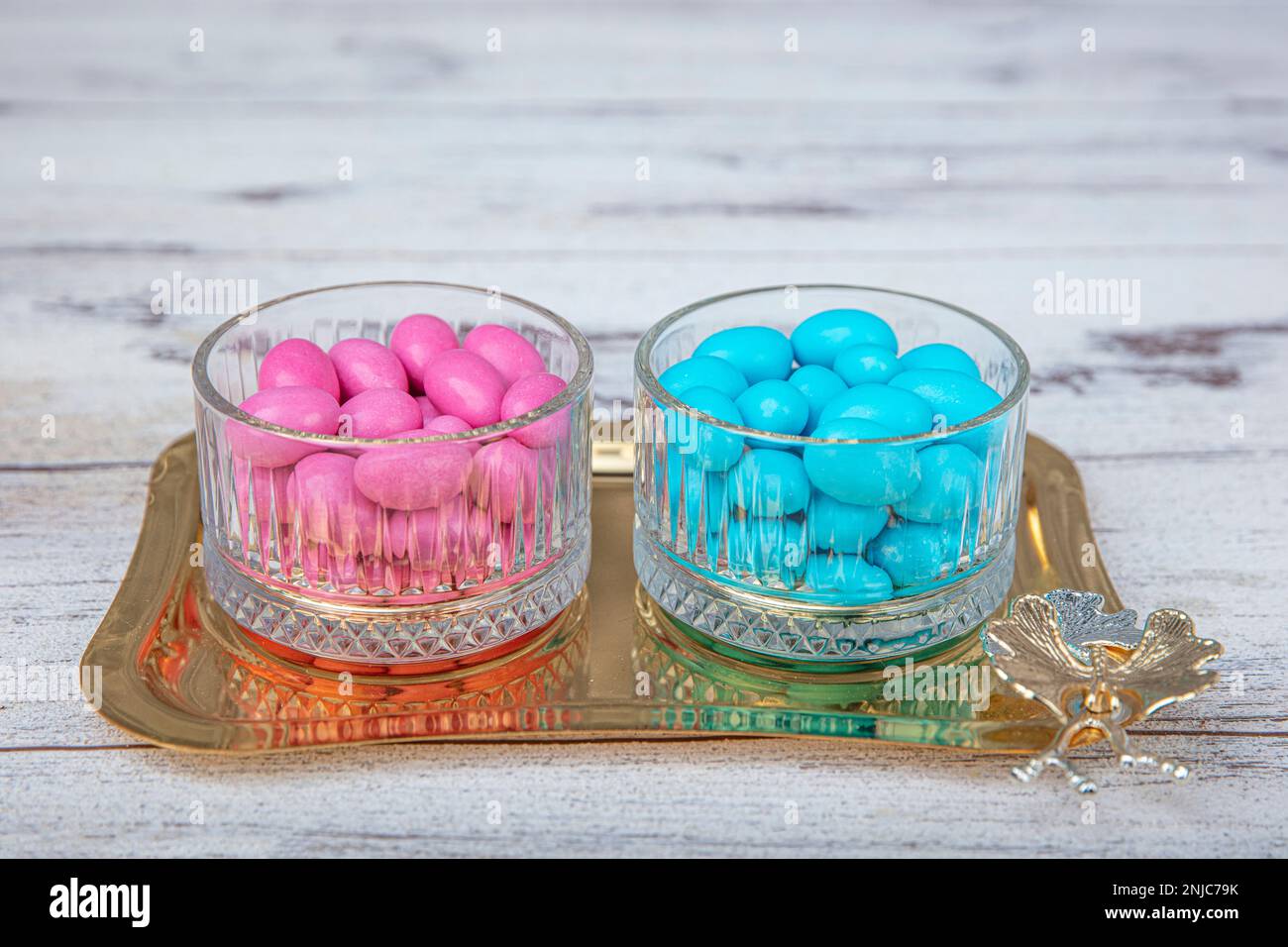 Colorful and chocolate covered almond candies in pastel tones in
