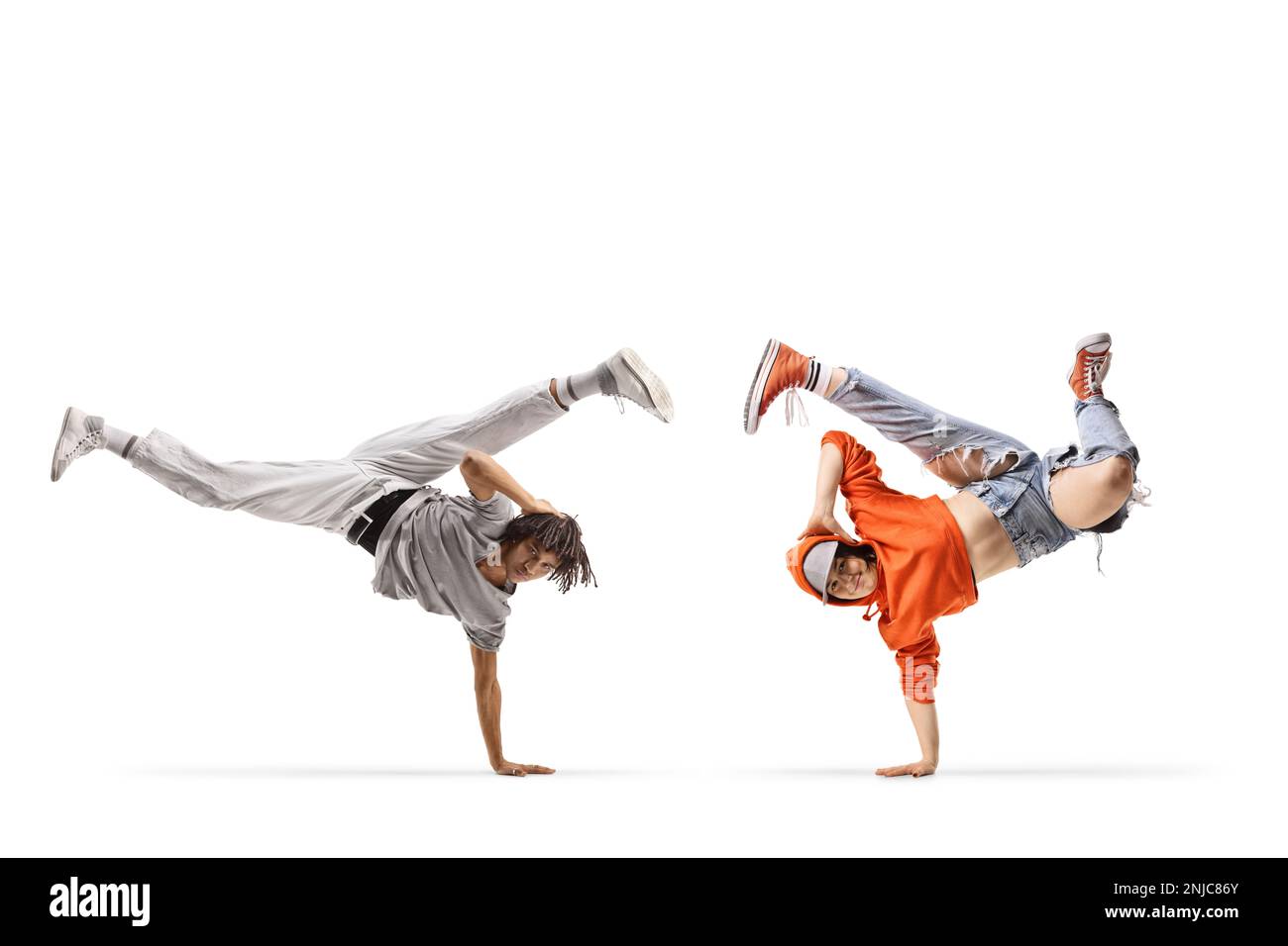 Caucasian female and an african american male performing a handstand isolated on white background Stock Photo