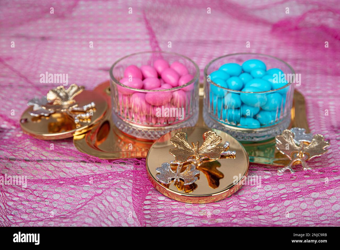 Colorful and chocolate covered almond candies in pastel tones in