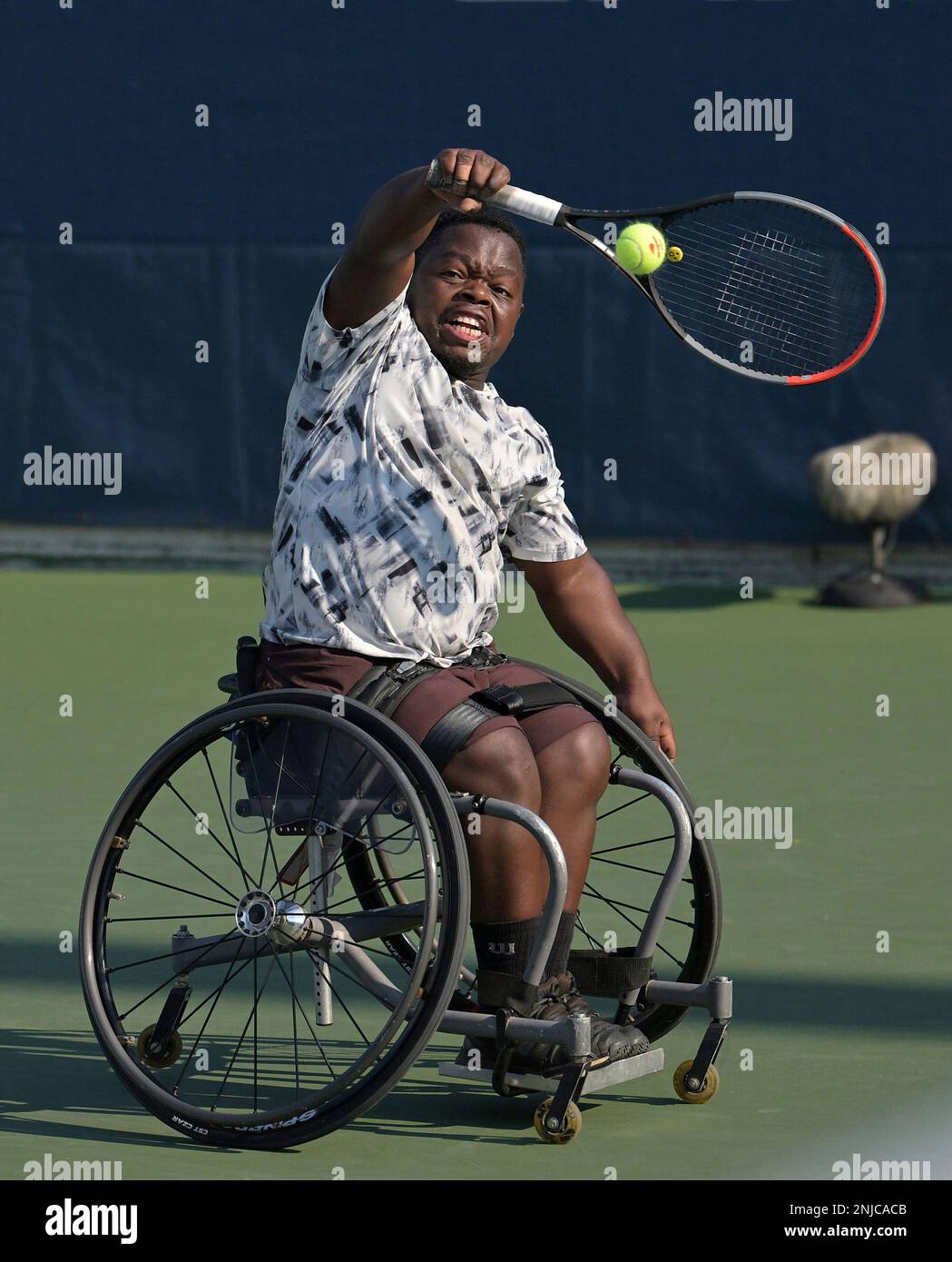 Donald Ramphadi returns during a wheelchair quad singles semifinal