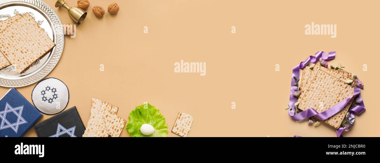 Banner with Passover Seder plate, Torah and matza on beige background