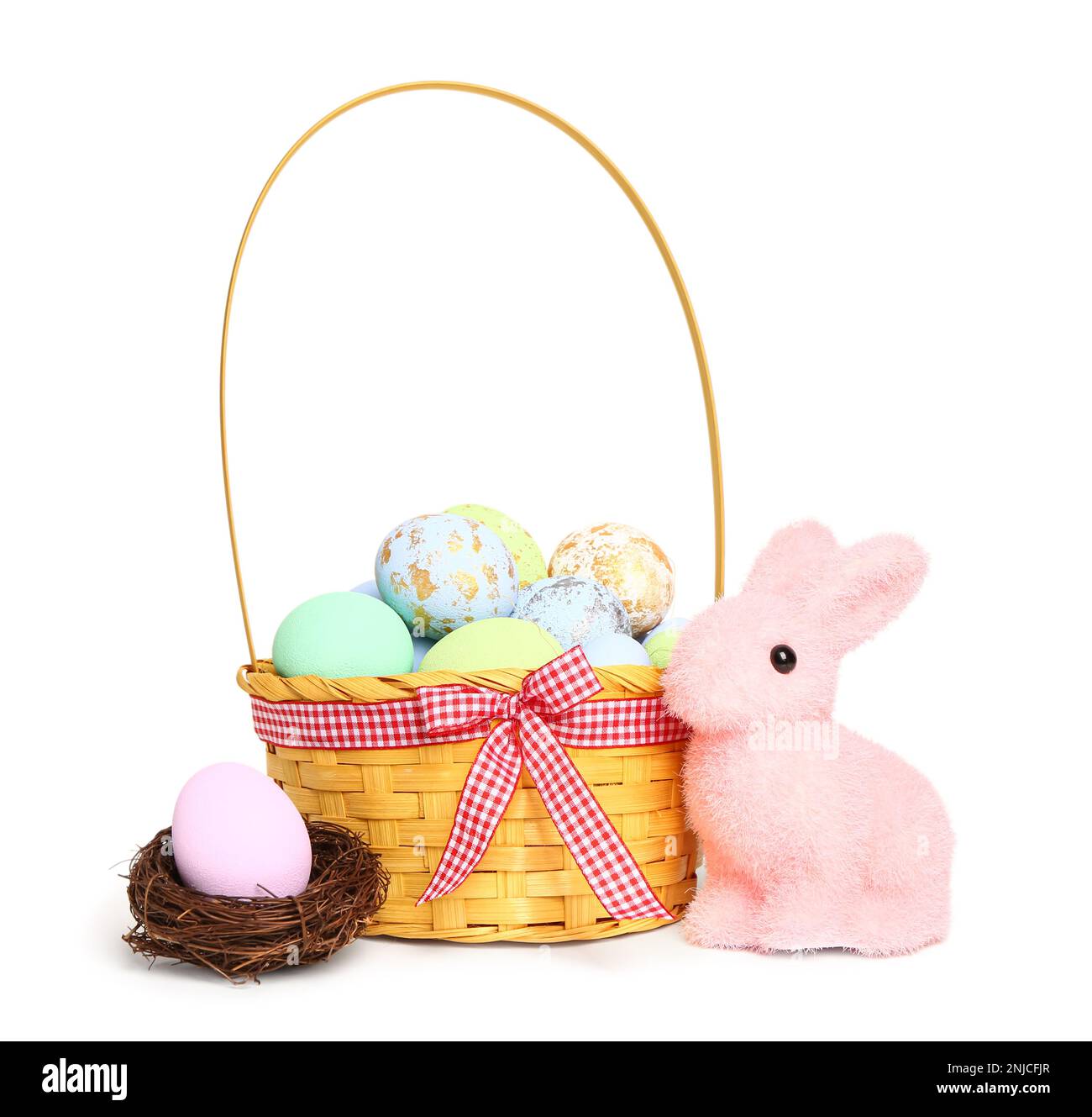 Wicker basket with painted Easter eggs and bunny isolated on white ...