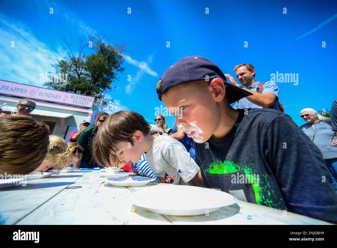 Covered in ice cream, Adam Willson, 6, Brattleboro, pushes through for
