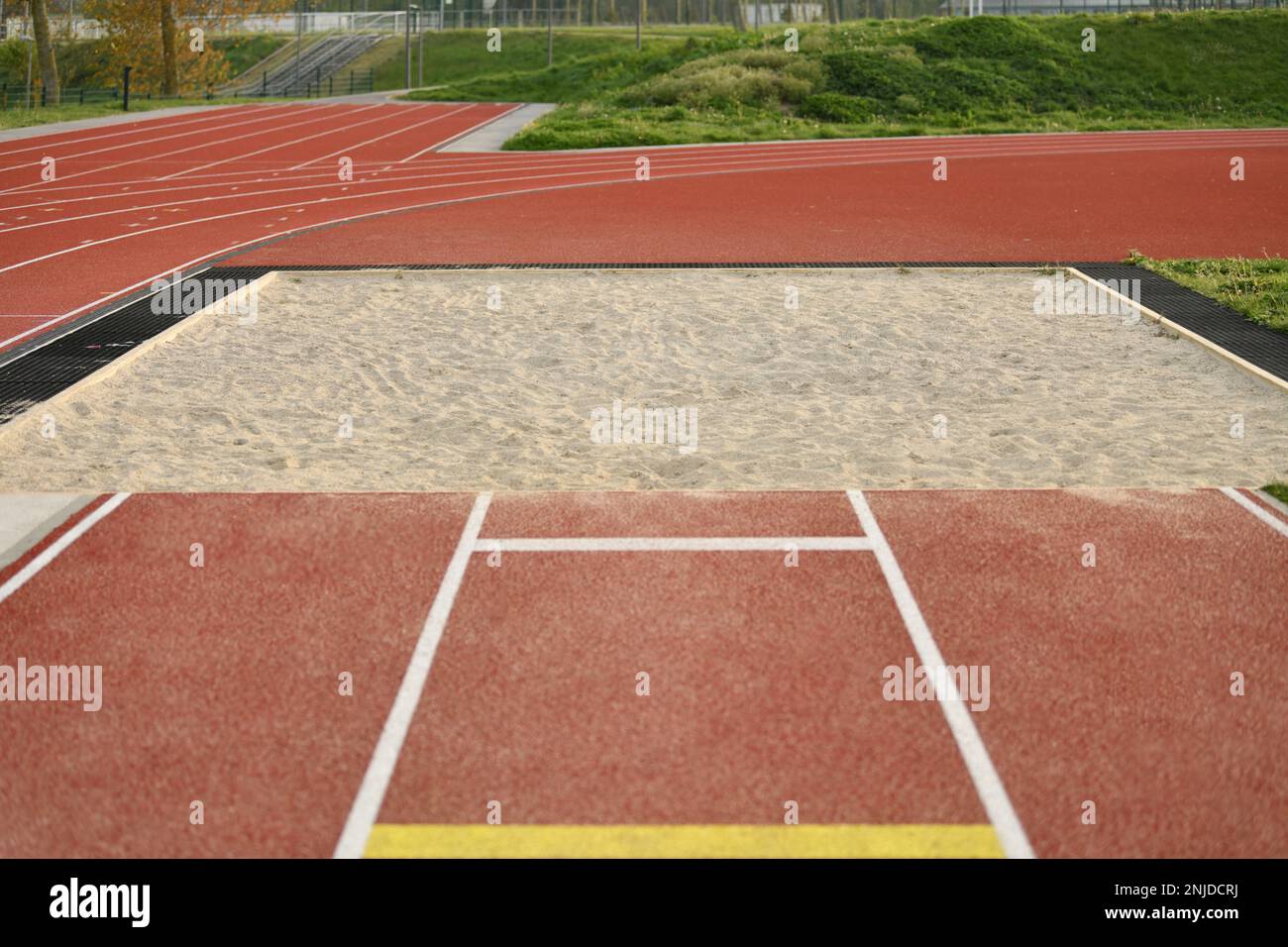 Sand pit for long jump at the stadium Stock Photo Alamy