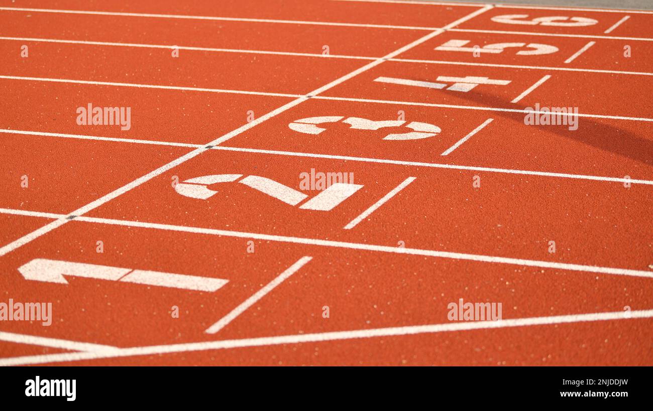 The red runway is numbered at a stadium Stock Photo