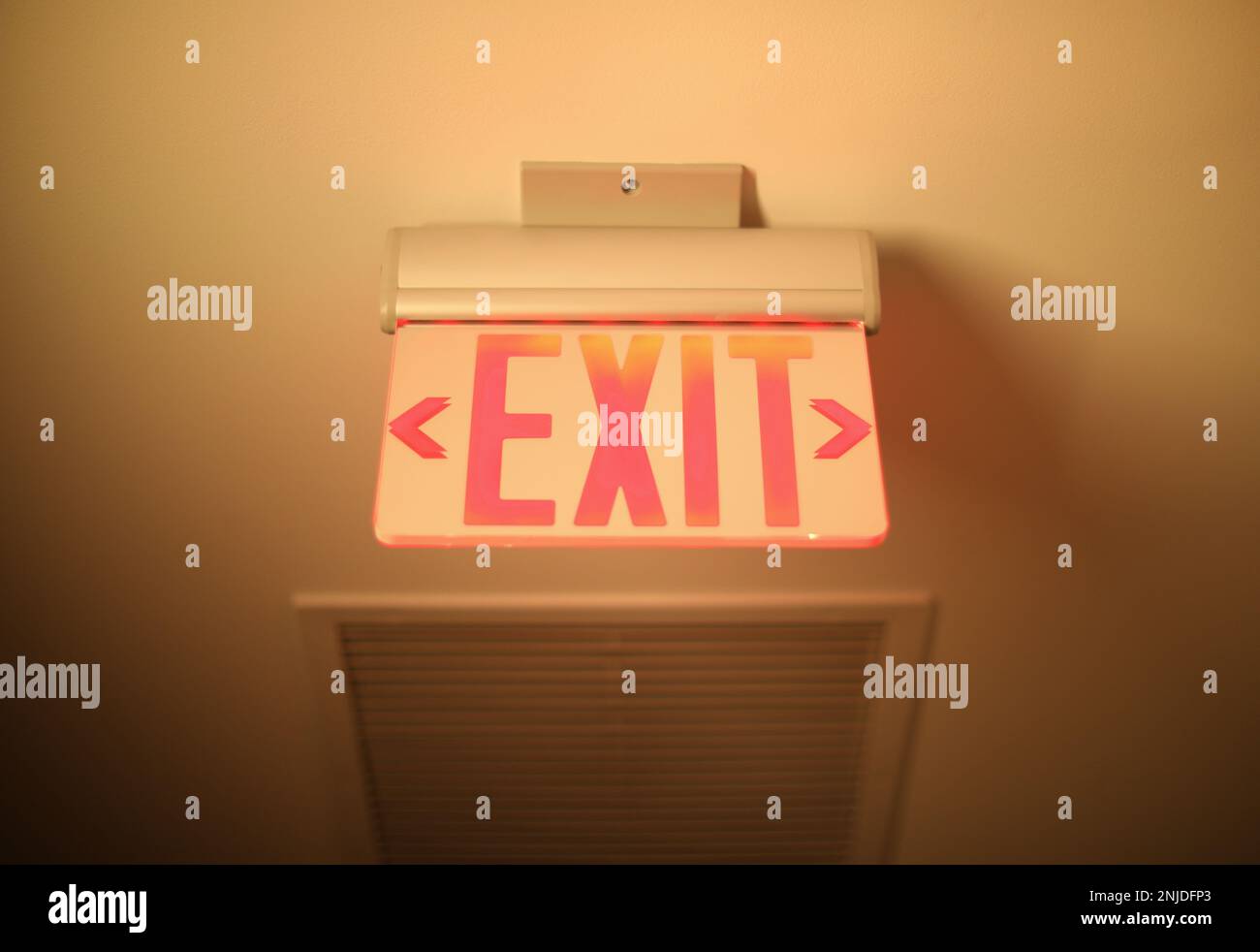 Hallway exit sign vibrant in corridor showing evacuation during