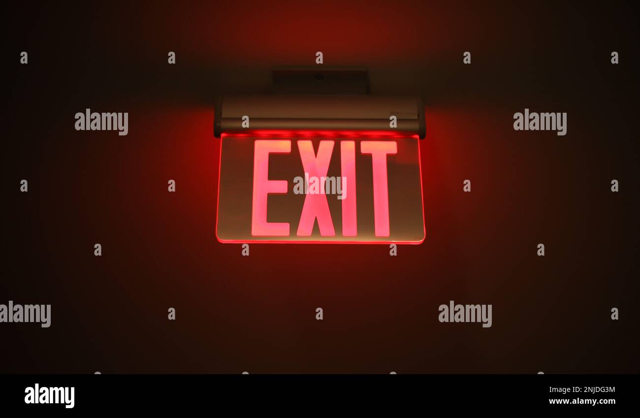 Hallway exit sign vibrant in corridor showing evacuation during