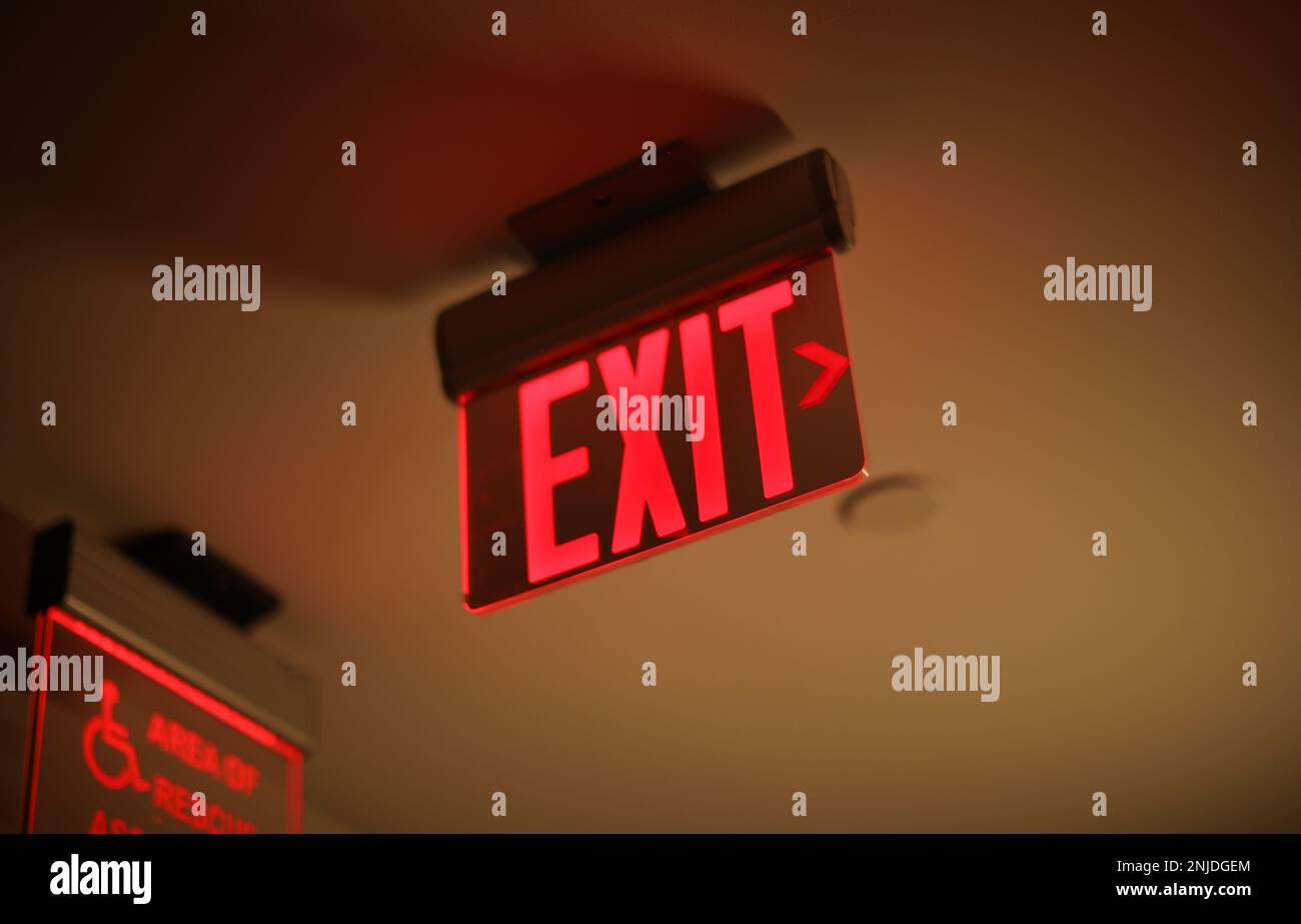 Hallway exit sign vibrant in corridor showing evacuation during