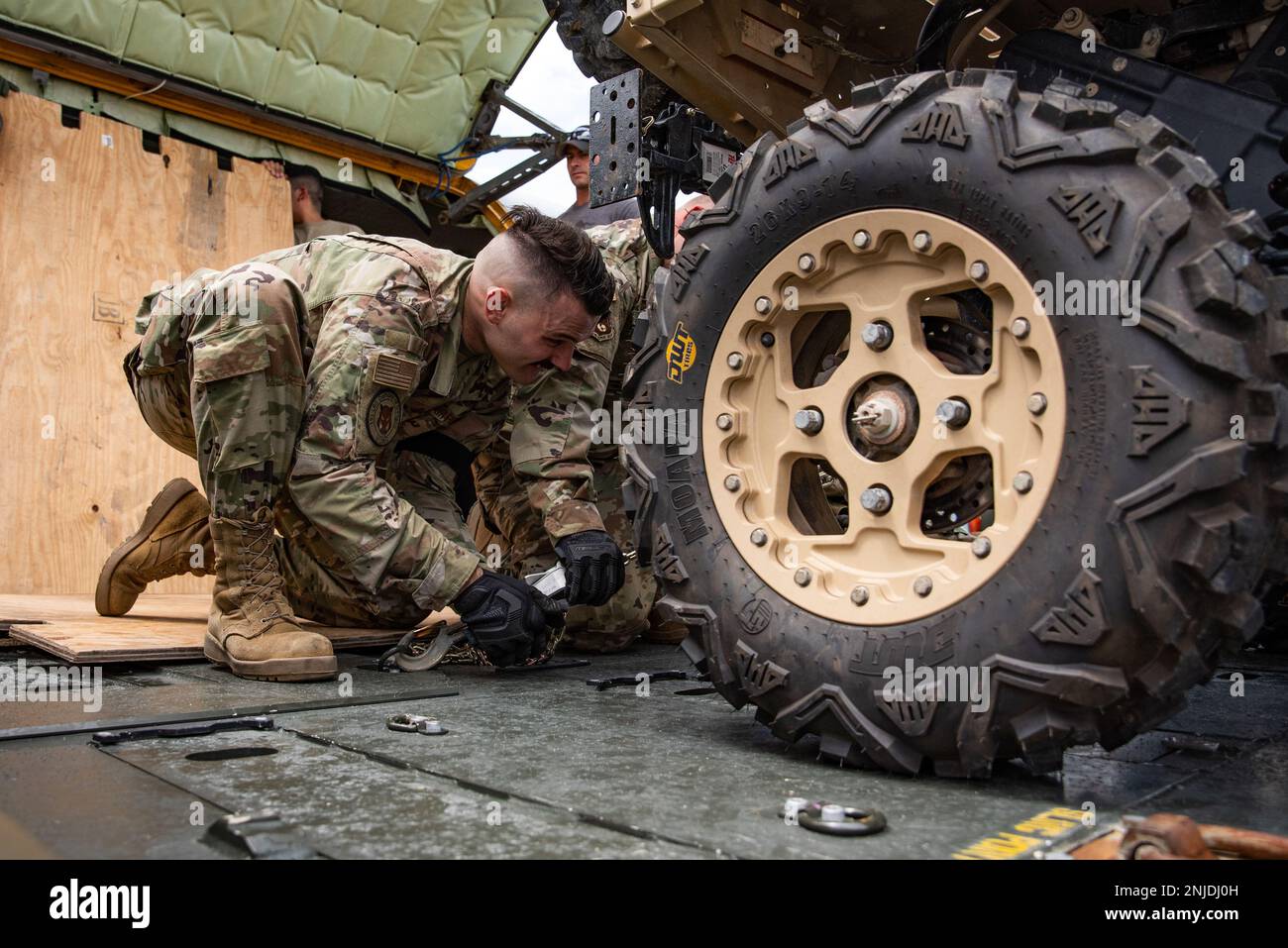 Airmen from the 151st Air Refueling Wing loaded a Polaris Military ...