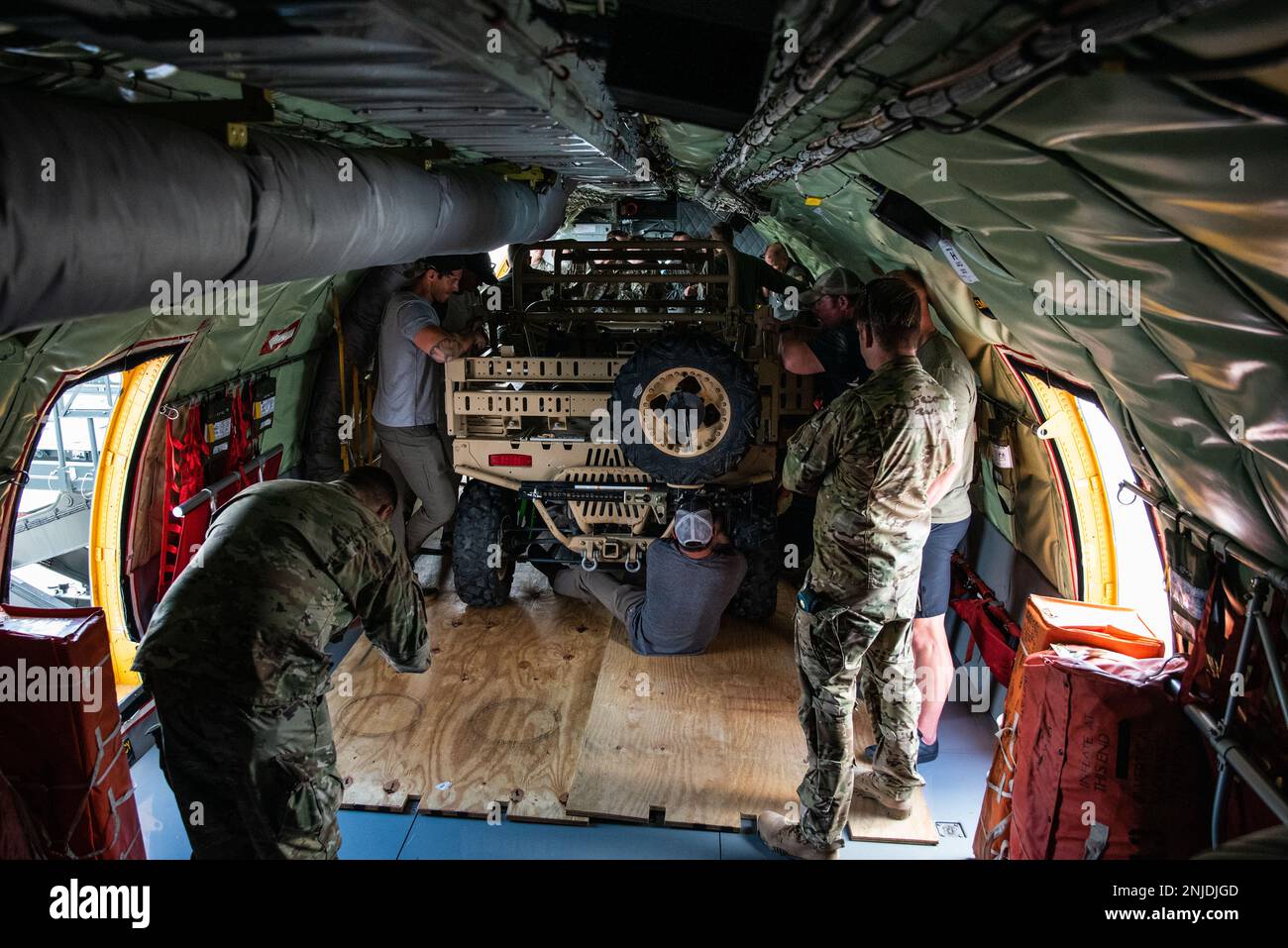 Airmen from the 151st Air Refueling Wing loaded a Polaris Military ...
