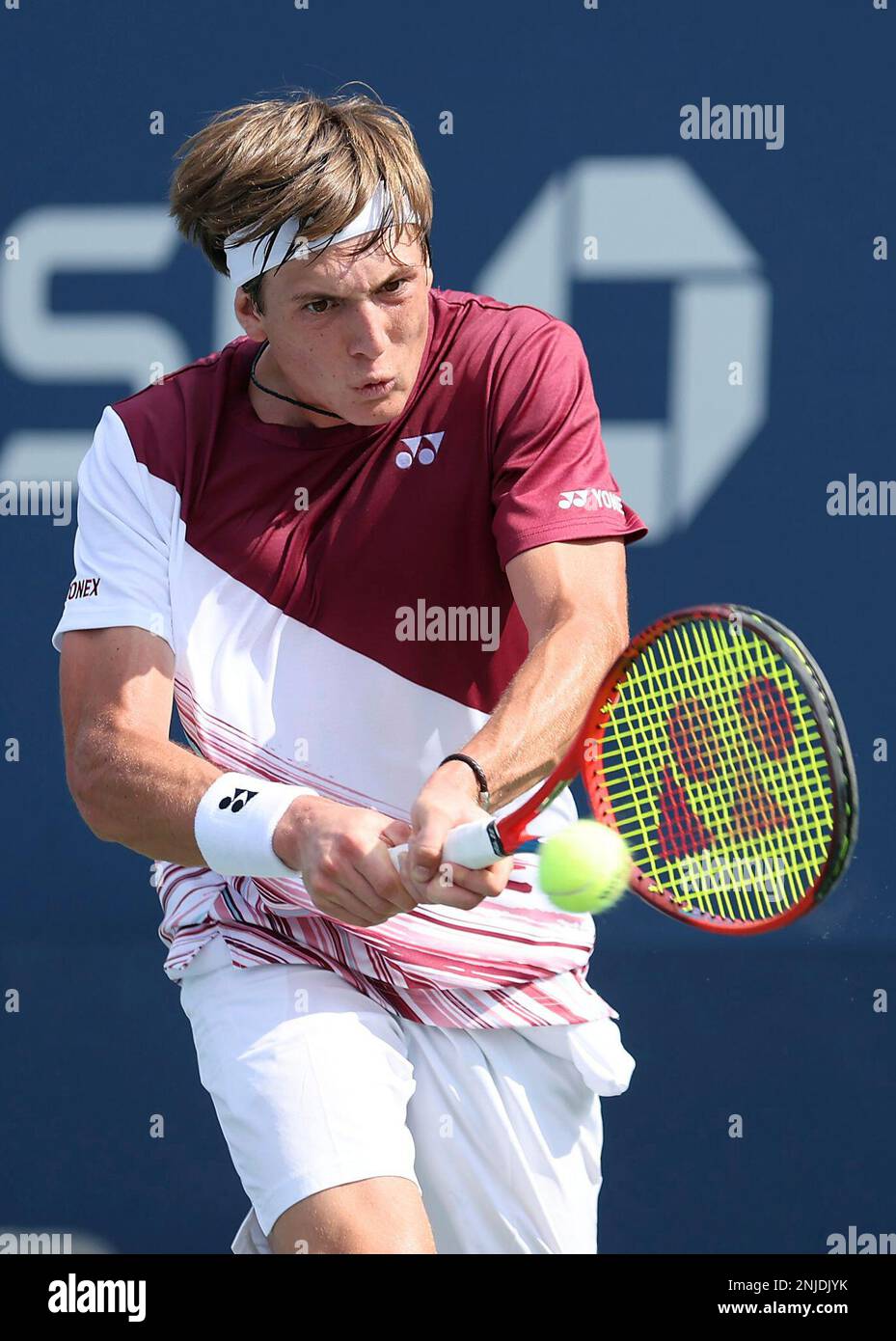 Lautaro Midon returns during a junior boys singles match at the 2022 US Open, Monday, Sep