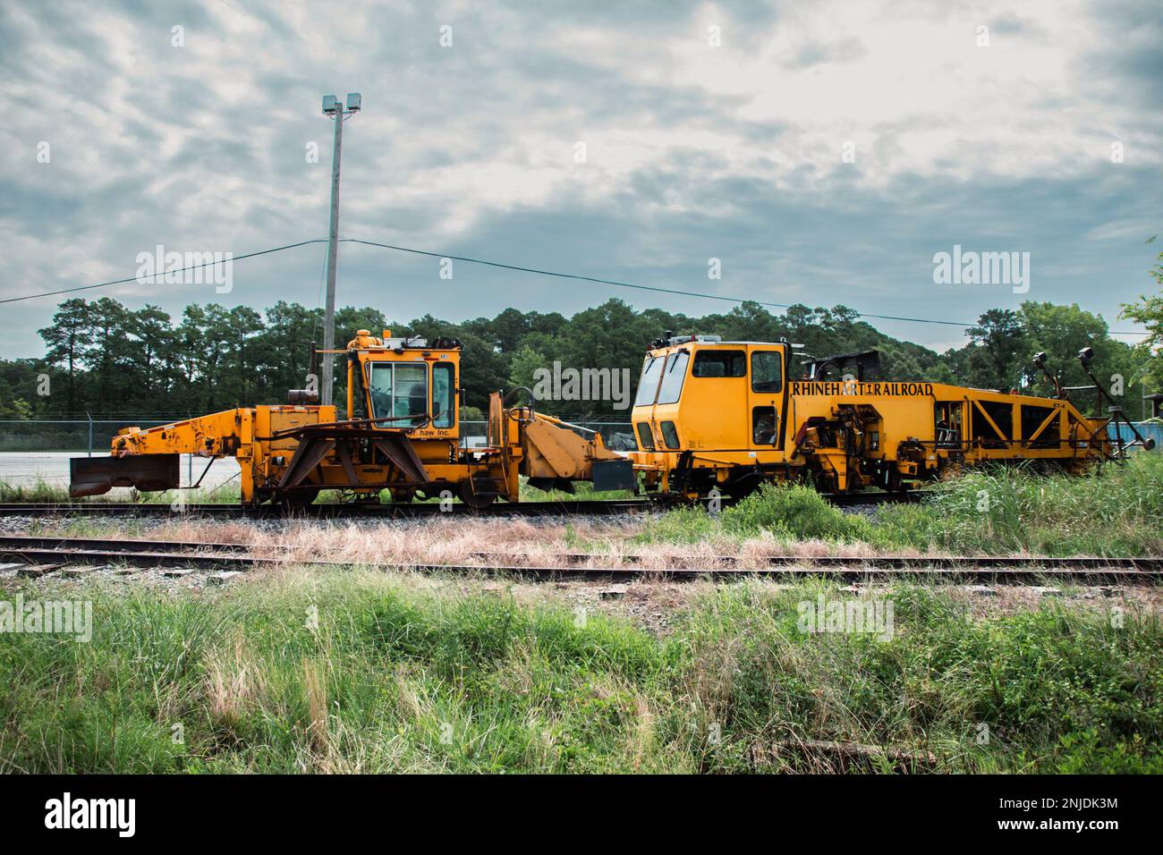 A ballast regulator is parked on a railway at Joint Base LangleyEustis
