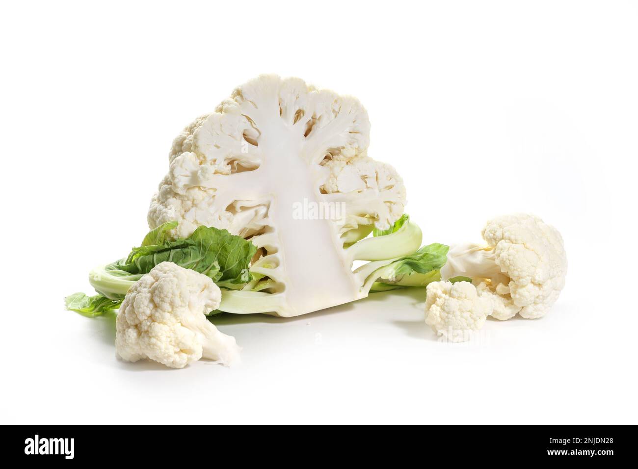 Halved cauliflower and two pieces or florets, healthy vegetable ingredient, food and cooking concept, isolated with small shadows on a white backgroun Stock Photo