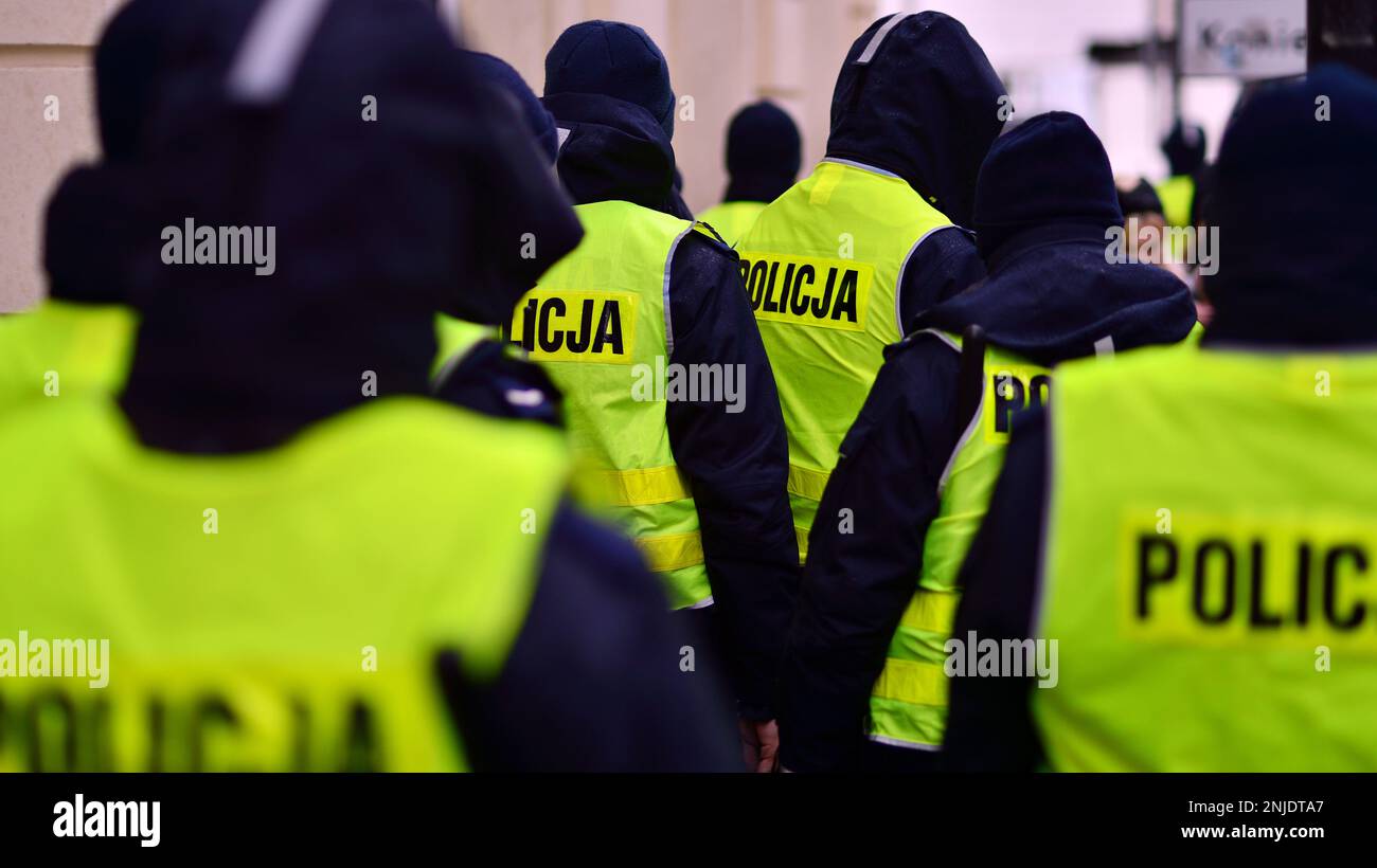 Polish policemen in yellow fluorescent jackets Stock Photo