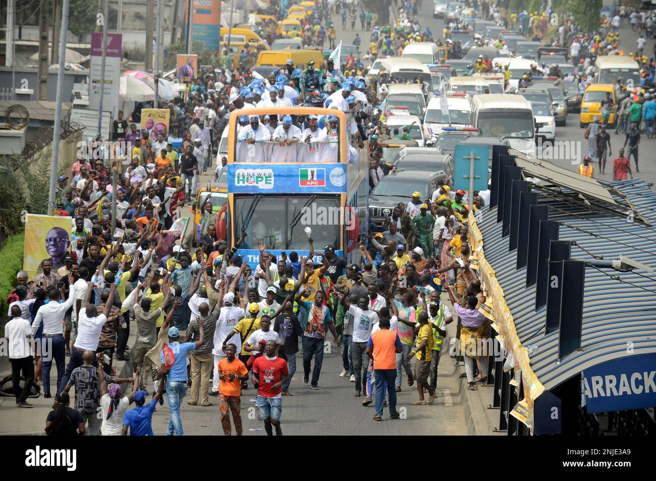 Lagos, Nigeria February 21, 2023 Party supporters crowd a bus as Asiwaju Bola Ahmed Tinubu, Presidential candidate, All Progressives Congress (APC) for 2023 Elections holds grand finale of his campaign at the Teslim Balogun Stadium in Surulere, Lagos on Tuesday, February 21, 2023. Photo by Adekunle Ajayi Stock Photo