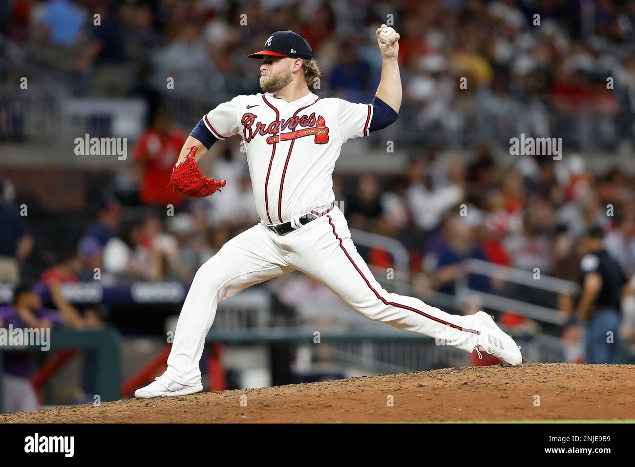 ATLANTA, GA - AUGUST 31: Atlanta Braves relief pitcher A.J. Minter (33)  delivers a pitch during the Wednesday evening MLB game between the Atlanta  Braves and the Colorado Rockies on August 31