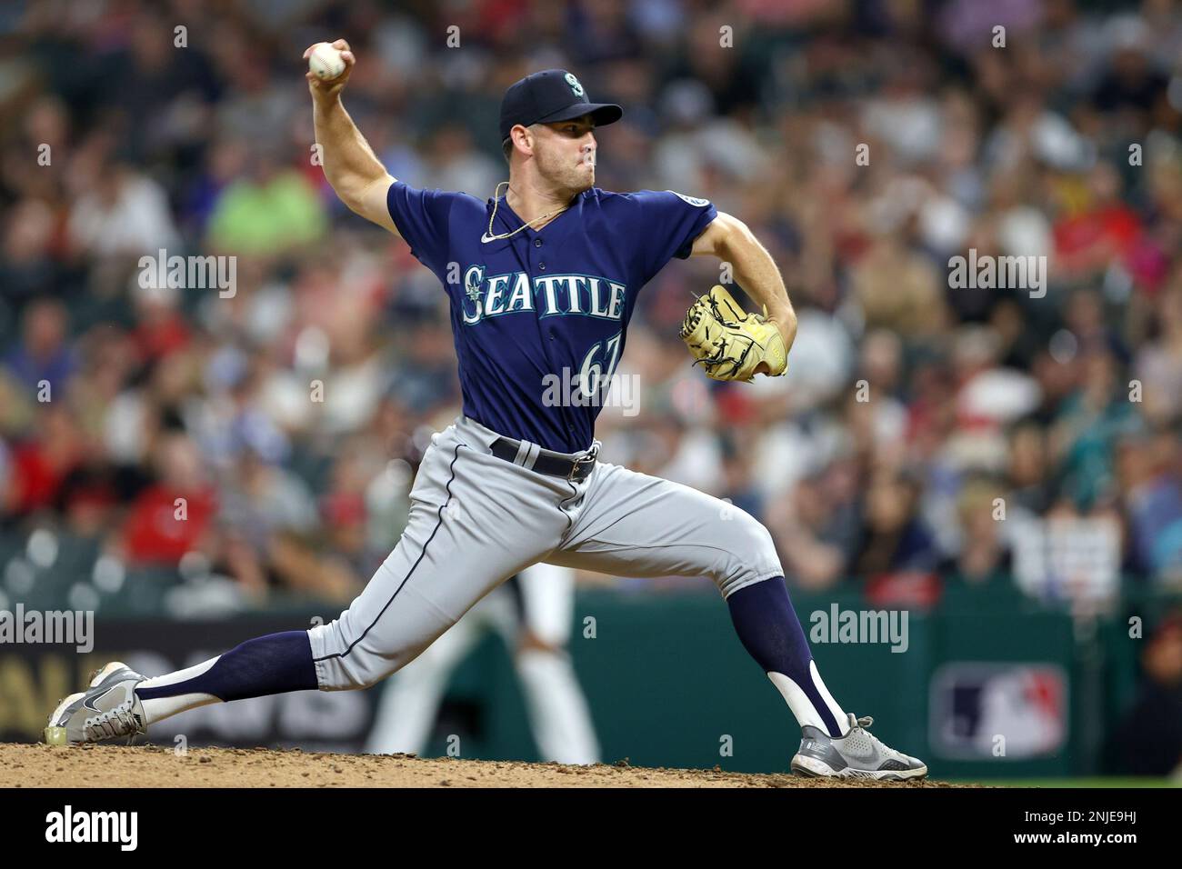 CLEVELAND, OH - SEPTEMBER 02: Seattle Mariners first baseman Ty France (23)  waits to put the home run helmet on Seattle Mariners catcher Cal Raleigh  (29) after Raleigh hit a home run