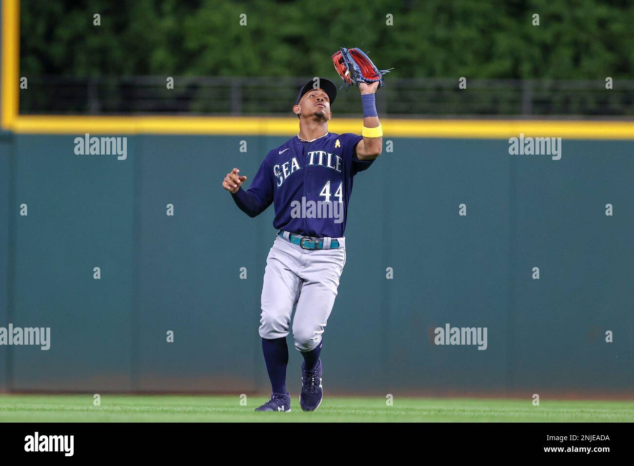 CLEVELAND, OH - SEPTEMBER 02: Seattle Mariners center fielder Julio  Rodriguez (44) puts the home run helmet on Seattle Mariners catcher Cal  Raleigh (29) after Raliegh hit his second home run of