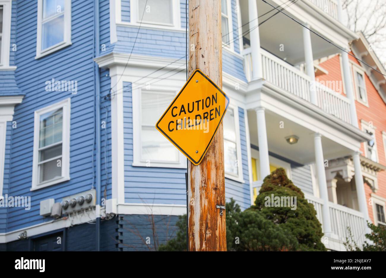 Pedestrian and children school zone yellow warning sign caution road sign Stock Photo