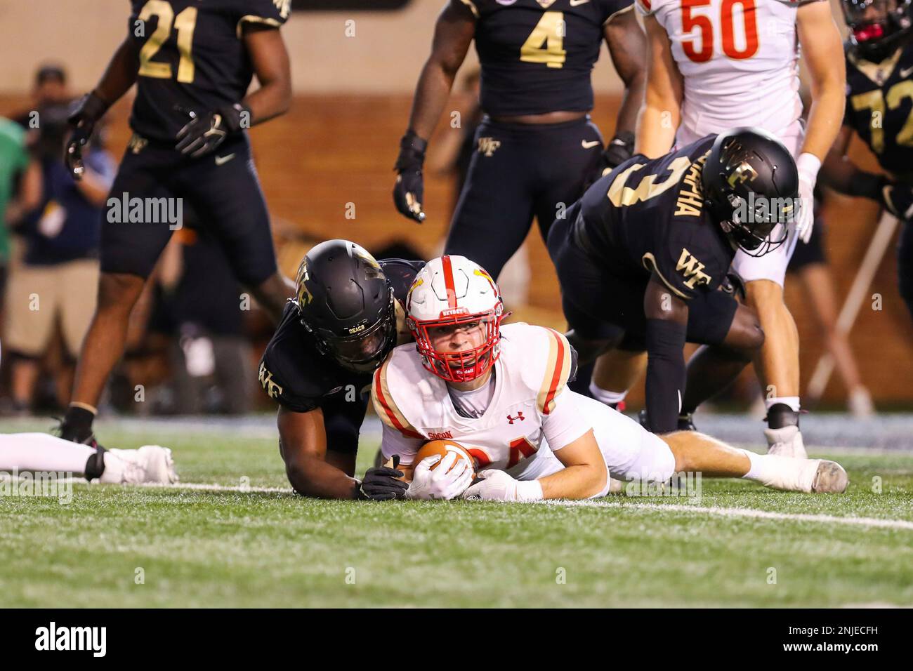 WINSTON-SALEM, NC - SEPTEMBER 01: Hunter Rice (24) of the Virginia Military  Institute Keydets looks to the sideline for the next play call after he was  tackled on an earlier play during