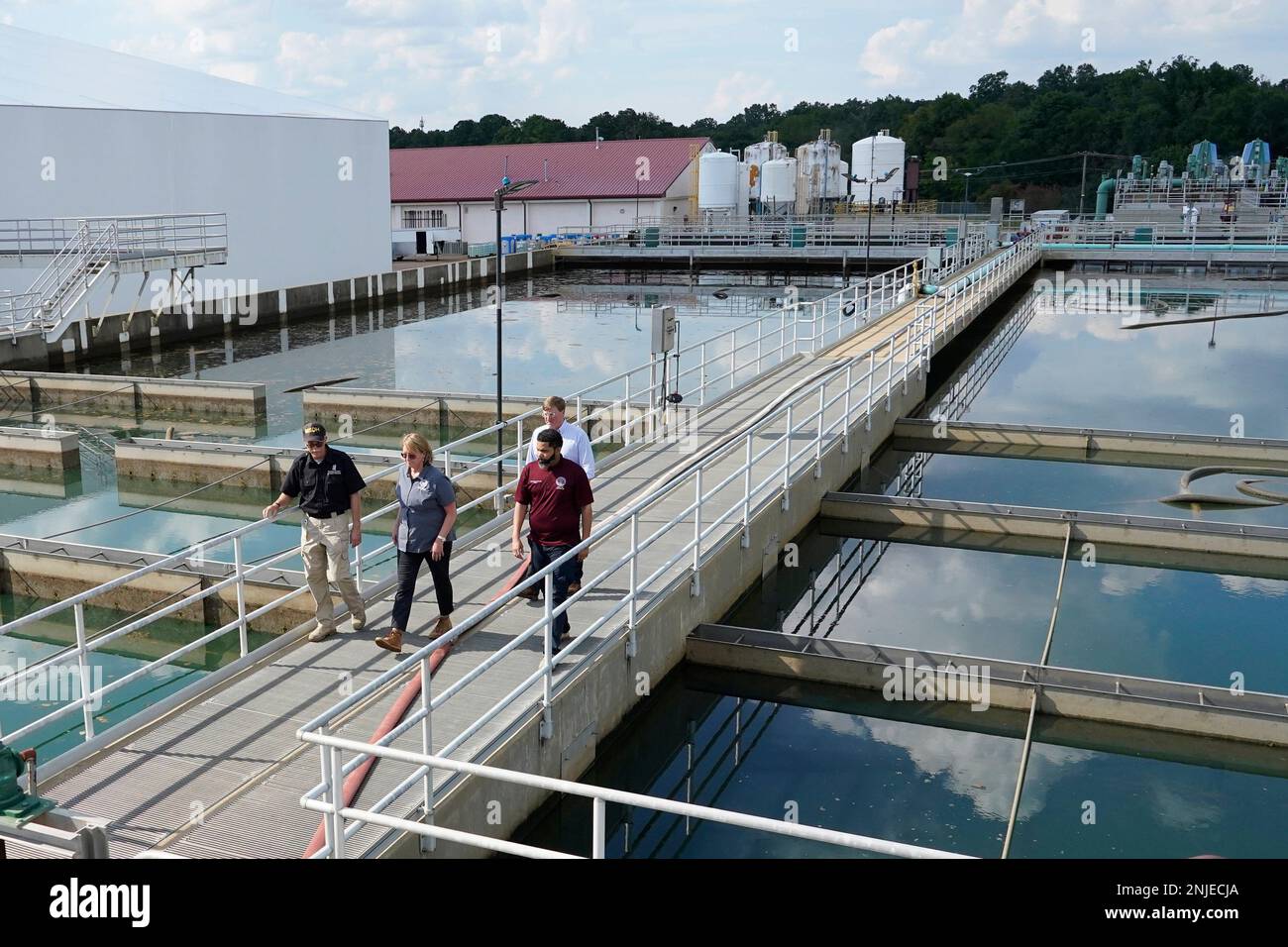 Jim Craig, with the Mississippi State Department of Health, left, leads