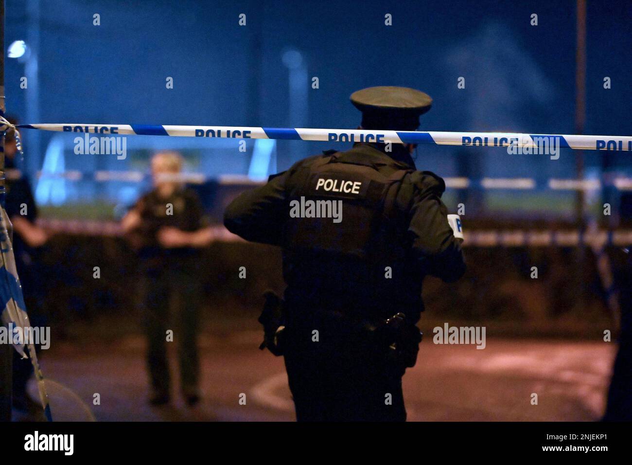 PSNI officers at the scene of a shooting in the Killyclogher Road area