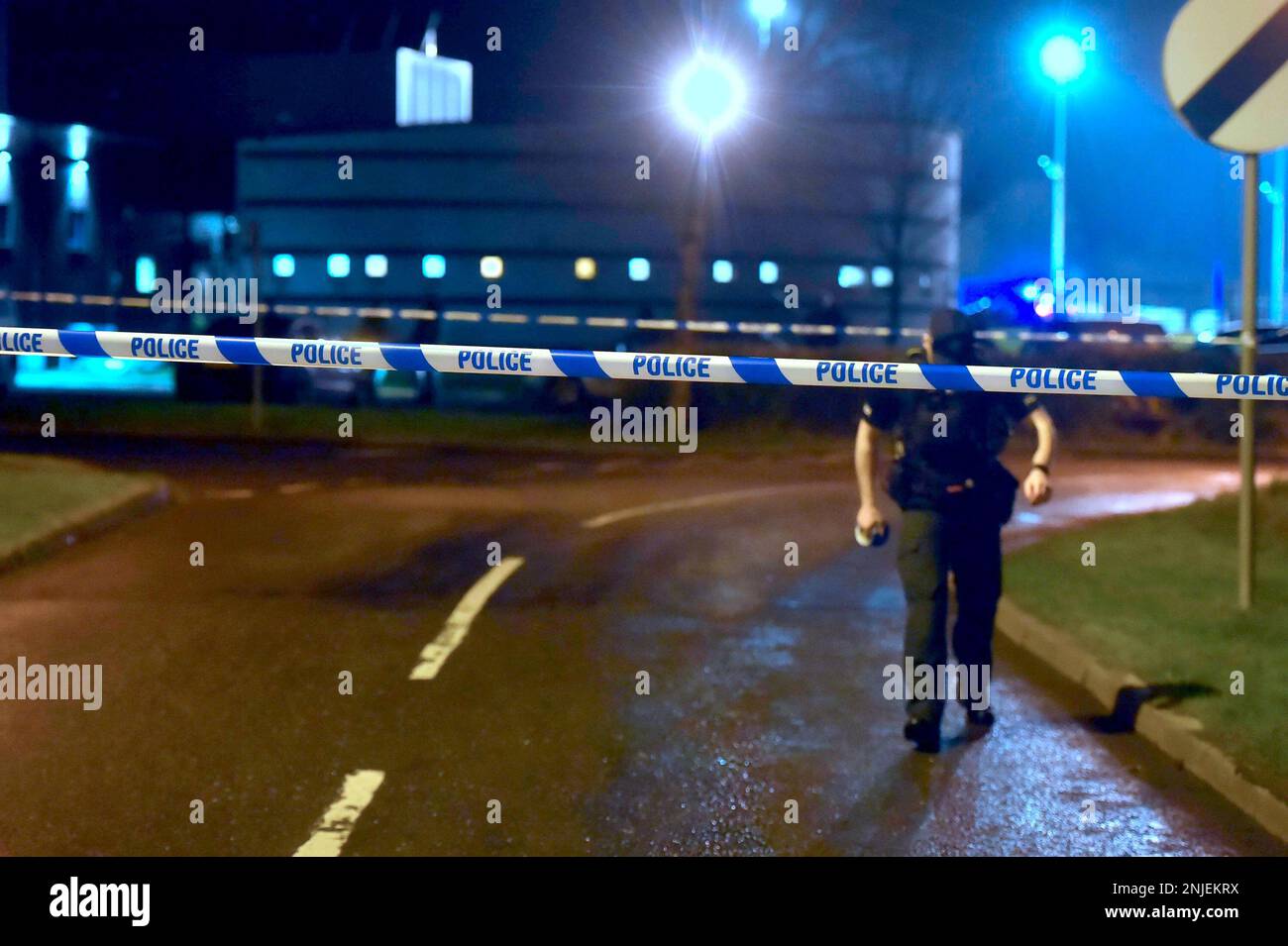PSNI officers at the scene of a shooting in the Killyclogher Road area