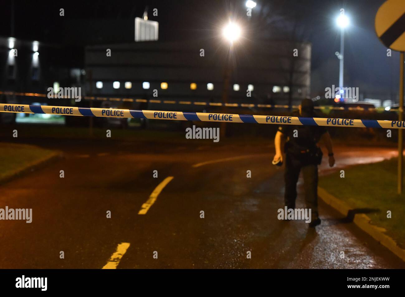 PSNI officers at the scene of a shooting in the Killyclogher Road area