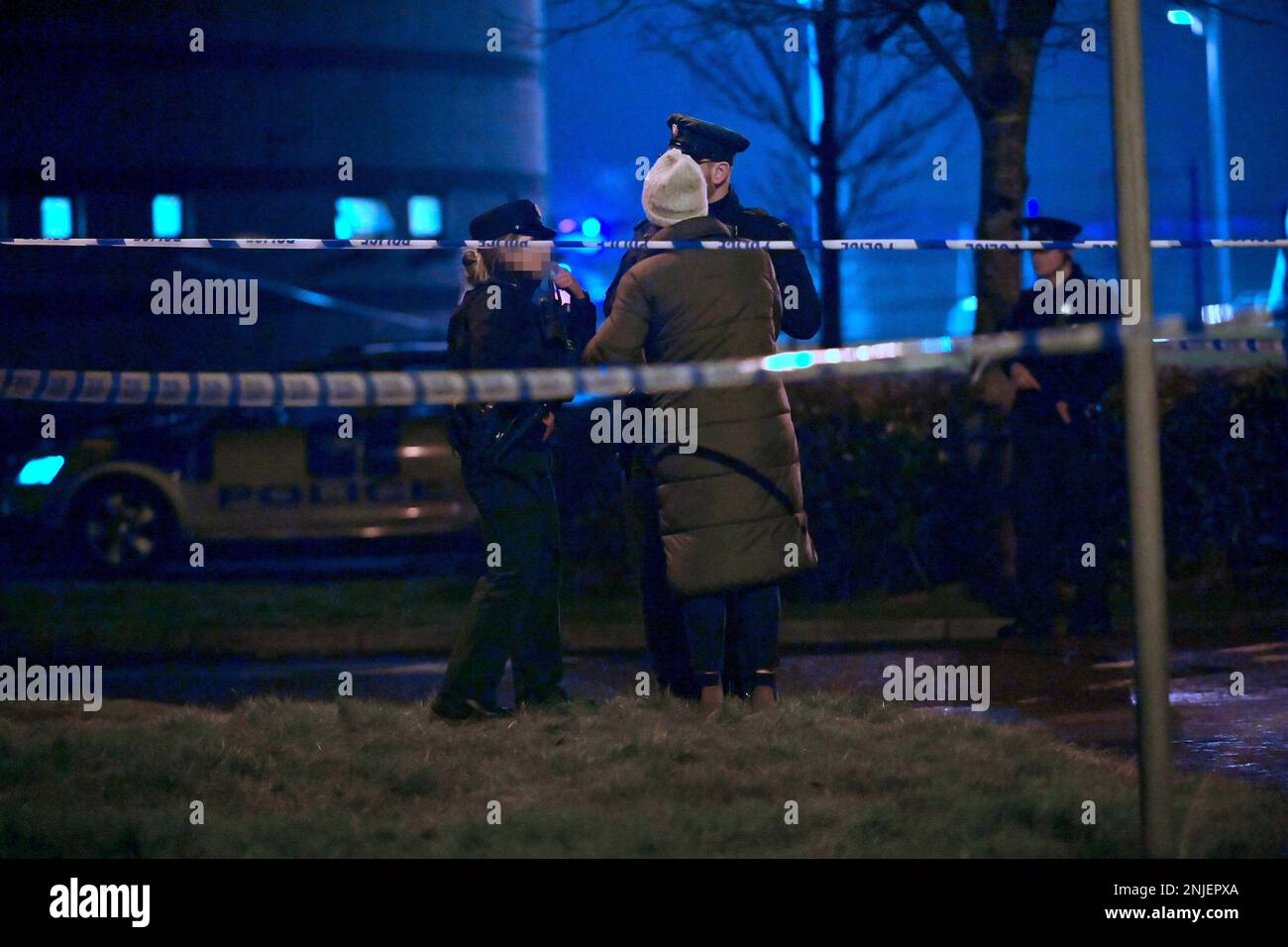 PSNI officers at the scene of a shooting in the Killyclogher Road area