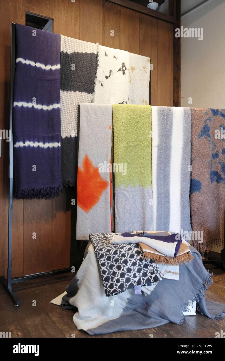 Blankets, tiedyeing by Arimatsu Shibori are hung and displayed in a